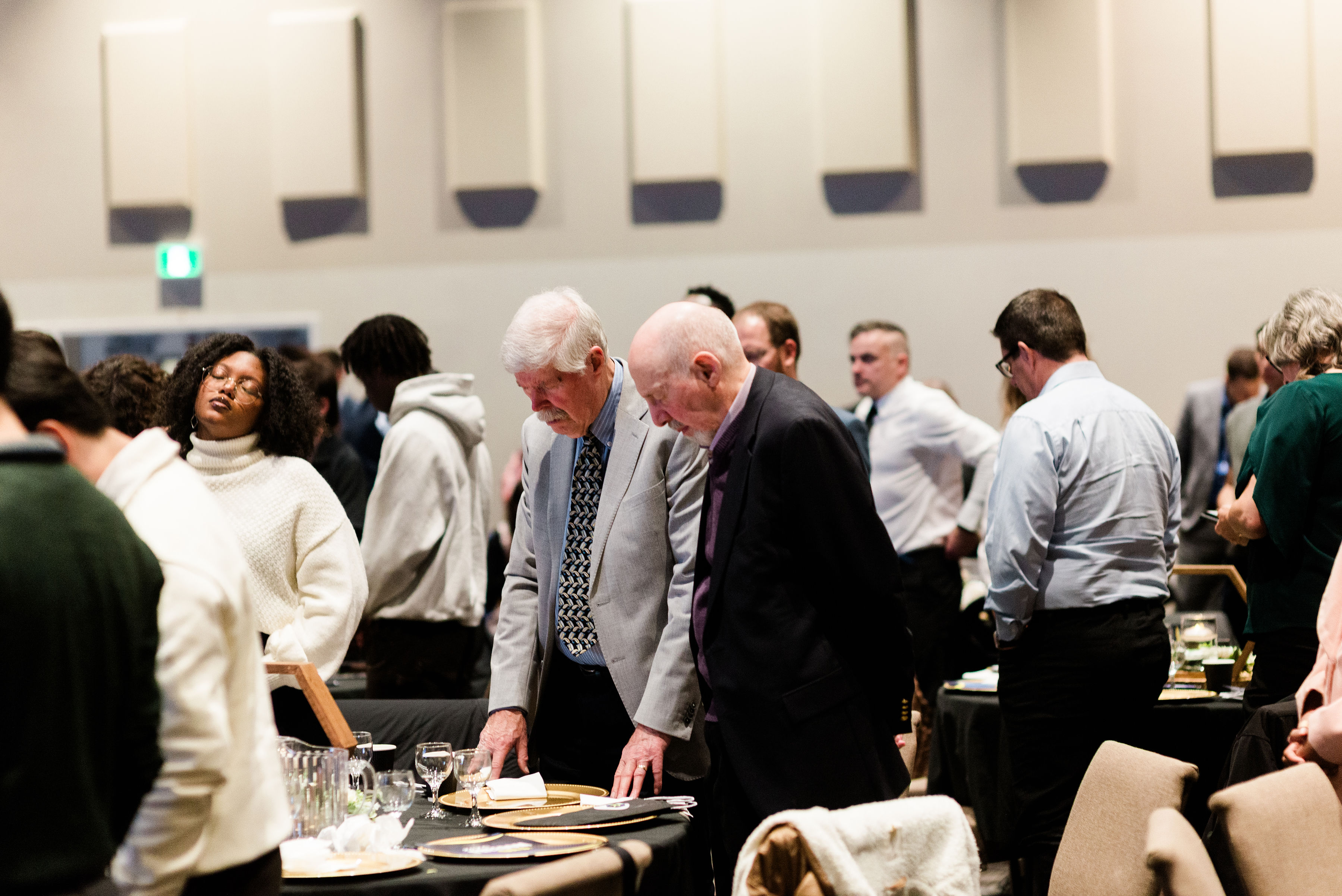 A guest talking with a Restored Ministries team member