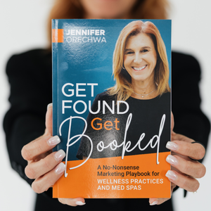 Jennifer Orechwa holding her book, Get Found Get Booked