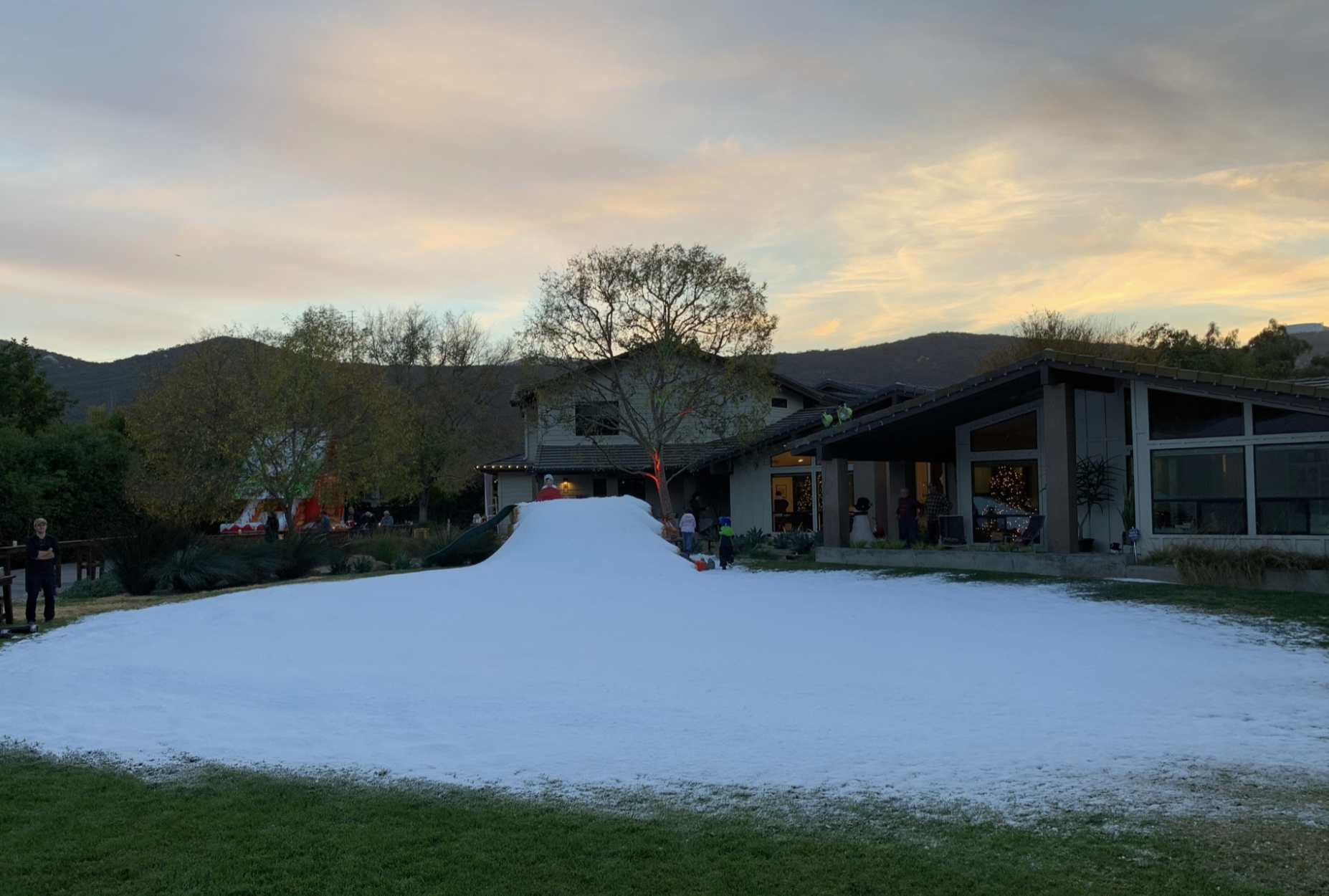 Real snow play and sledding at an outdoor winter event