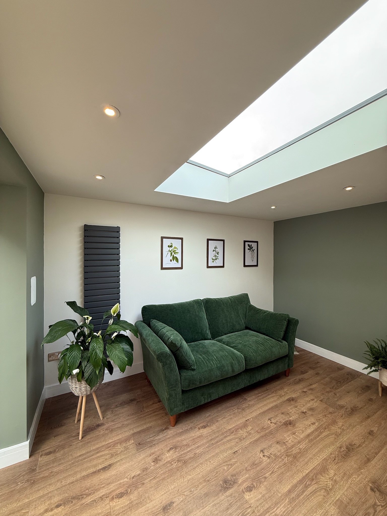 Detached garage conversion in Failsworth transformed into a snug and utility room featuring a large roof lantern, modern flooring, spotlights and natural light throughout. Detached garage conversion in Failsworth transformed into a snug and utility room featuring a large roof lantern, modern flooring, spotlights and natural light throughout.