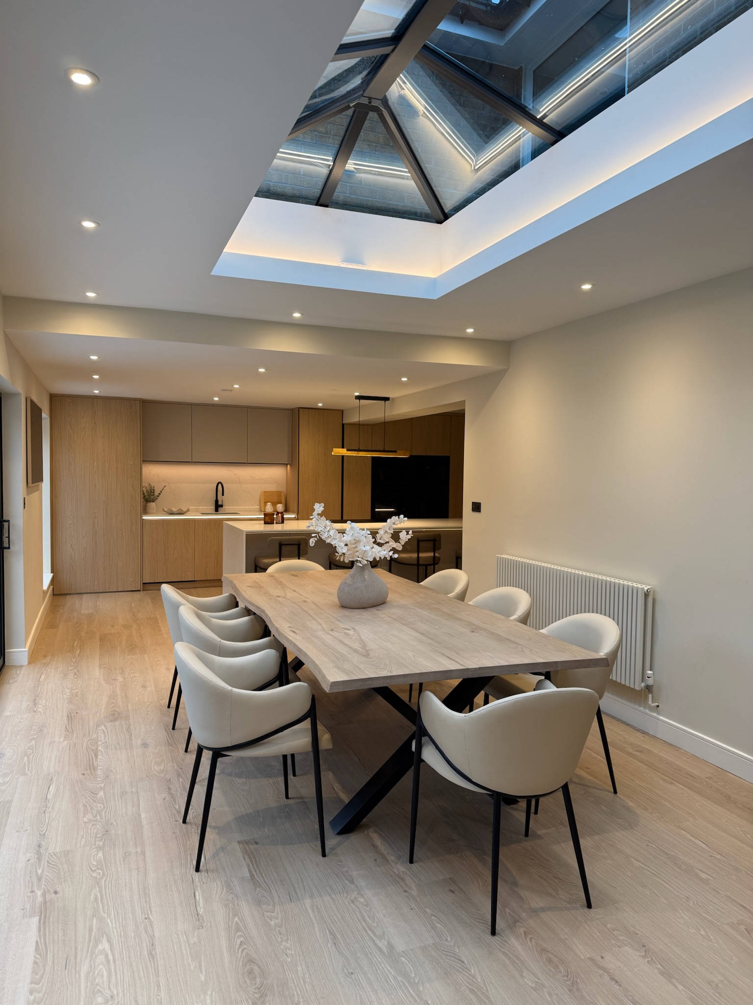 Modern rear extension in Rochdale featuring a large roof lantern, open plan dining area and contemporary kitchen design Modern rear extension in Rochdale featuring a large roof lantern, open plan dining area and contemporary kitchen design