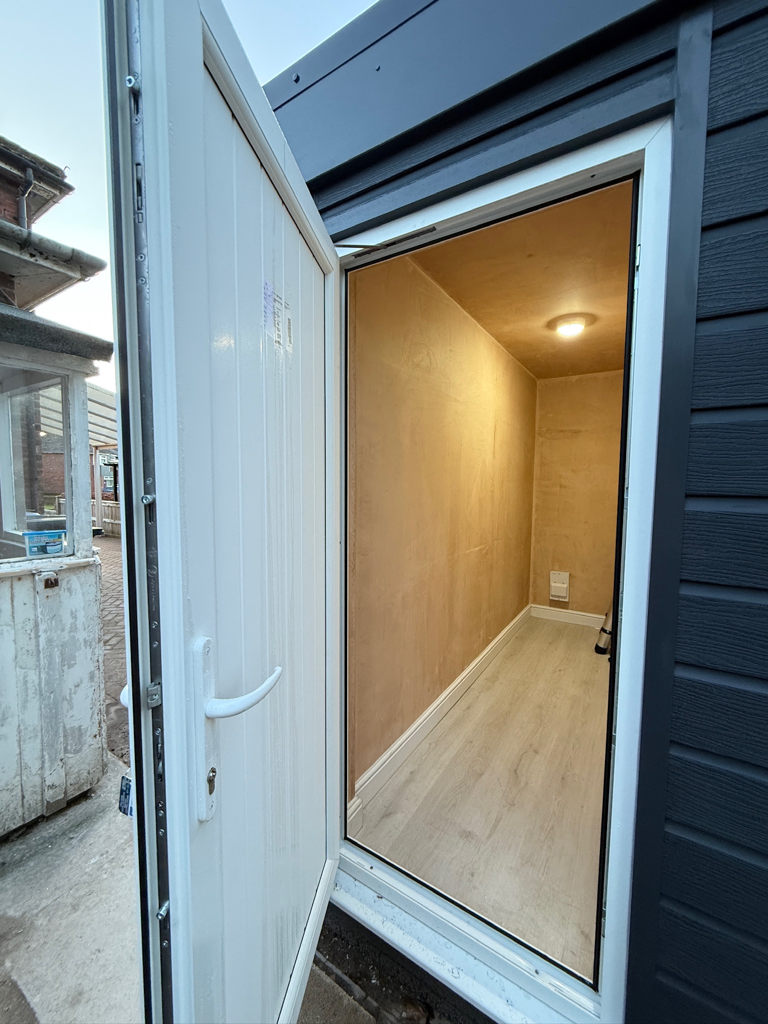 Garage conversion completed in Cheadle with retained front storage area, anthracite cladding and secure external access door. Garage conversion completed in Cheadle with retained front storage area, anthracite cladding and secure external access door.