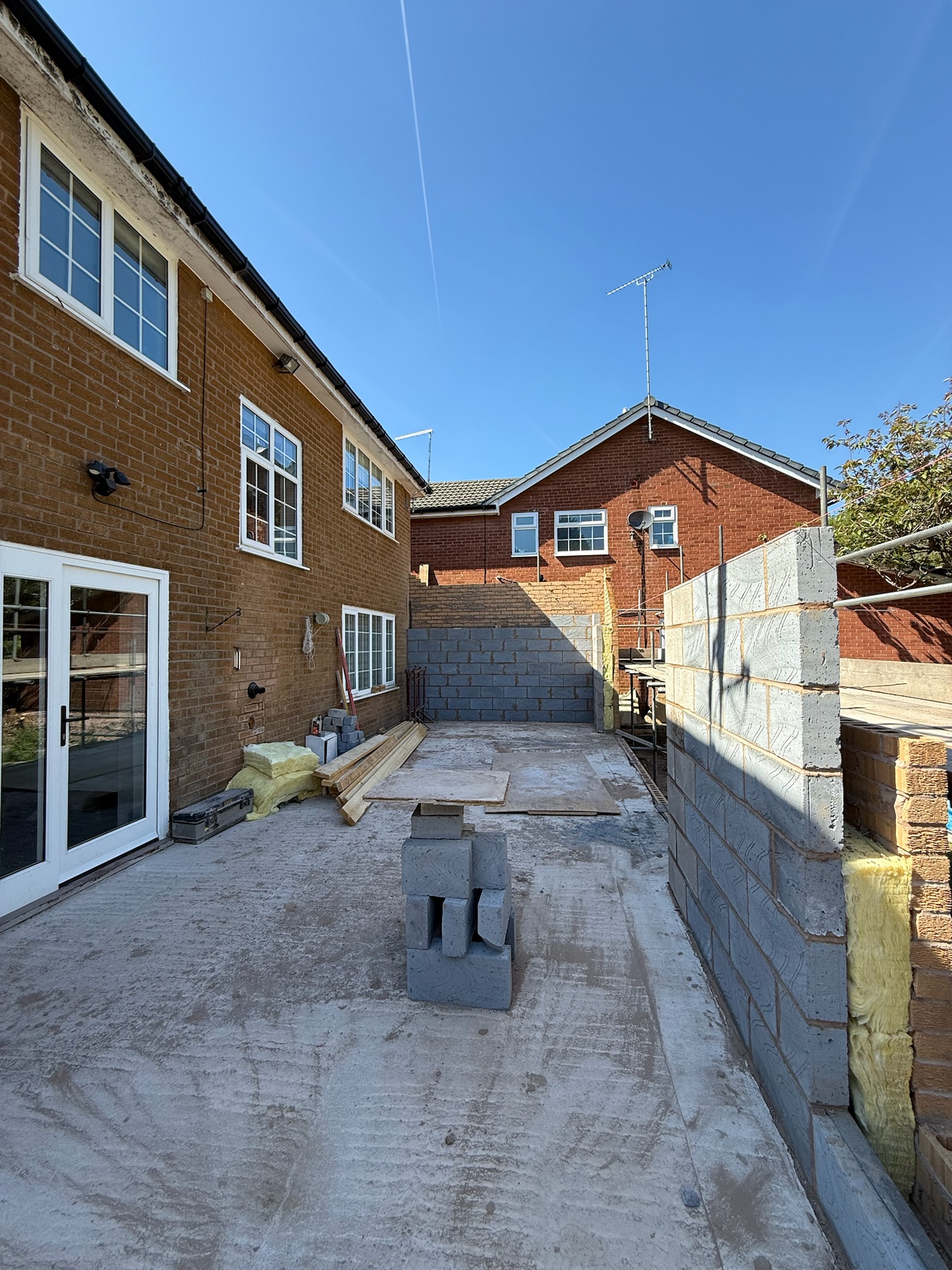 Rear home extension construction stage showing blockwork, structural walls and groundwork during the early build phase Rear home extension construction stage showing blockwork, structural walls and groundwork during the early build phase