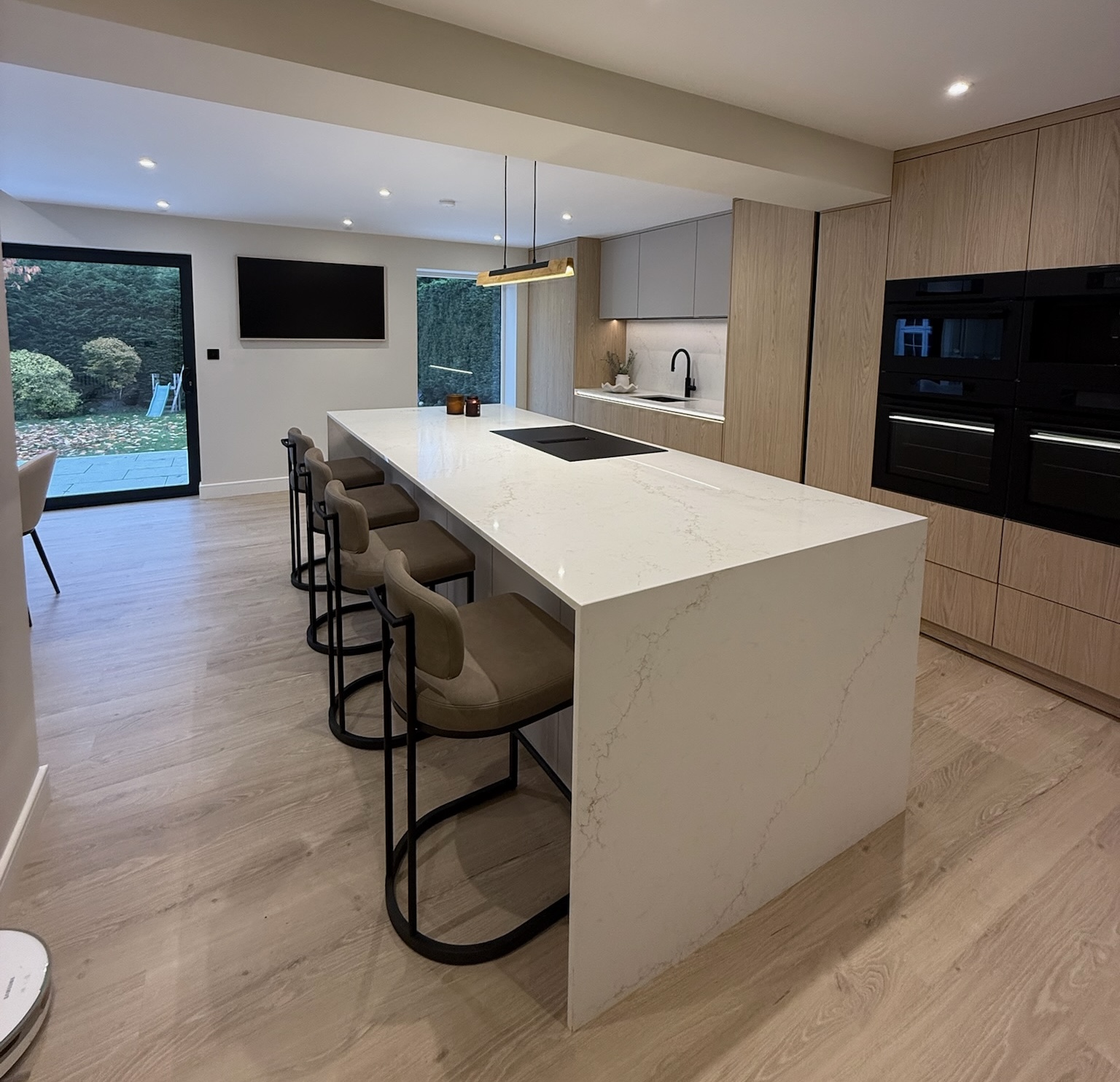Completed rear house extension with modern kitchen installation, large island, fitted cabinetry, flooring and final finishing works completed Completed rear house extension with modern kitchen installation, large island, fitted cabinetry, flooring and final finishing works completed