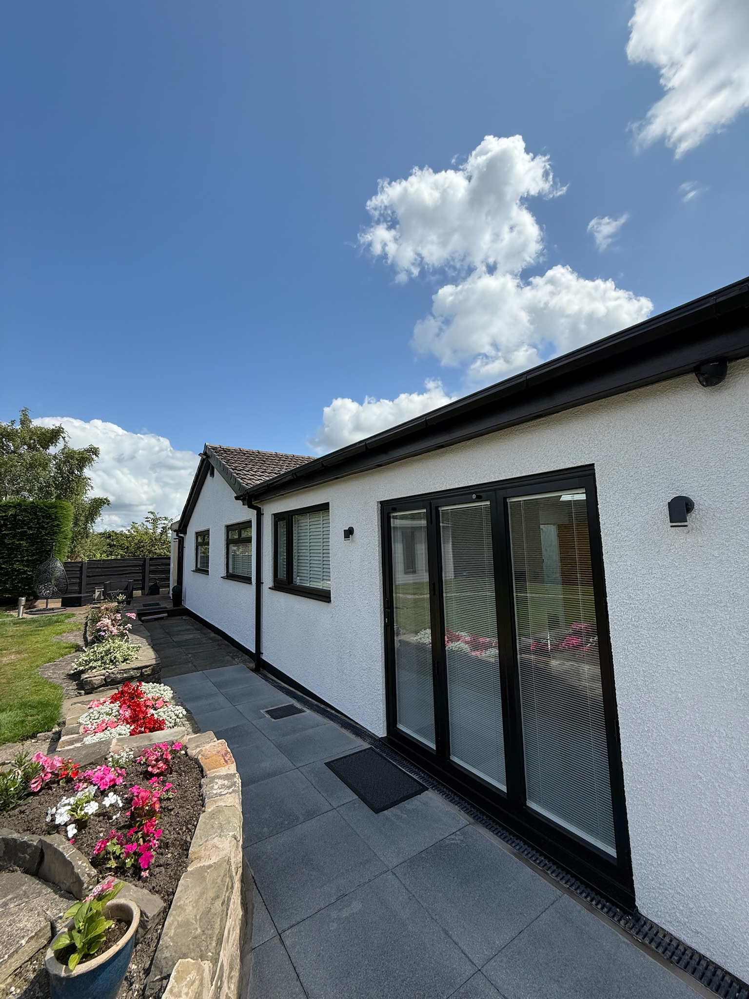 Home extension completed in Bury featuring large bifold doors, skylights and modern open plan living space with additional natural light Home extension completed in Bury featuring large bifold doors, skylights and modern open plan living space with additional natural light