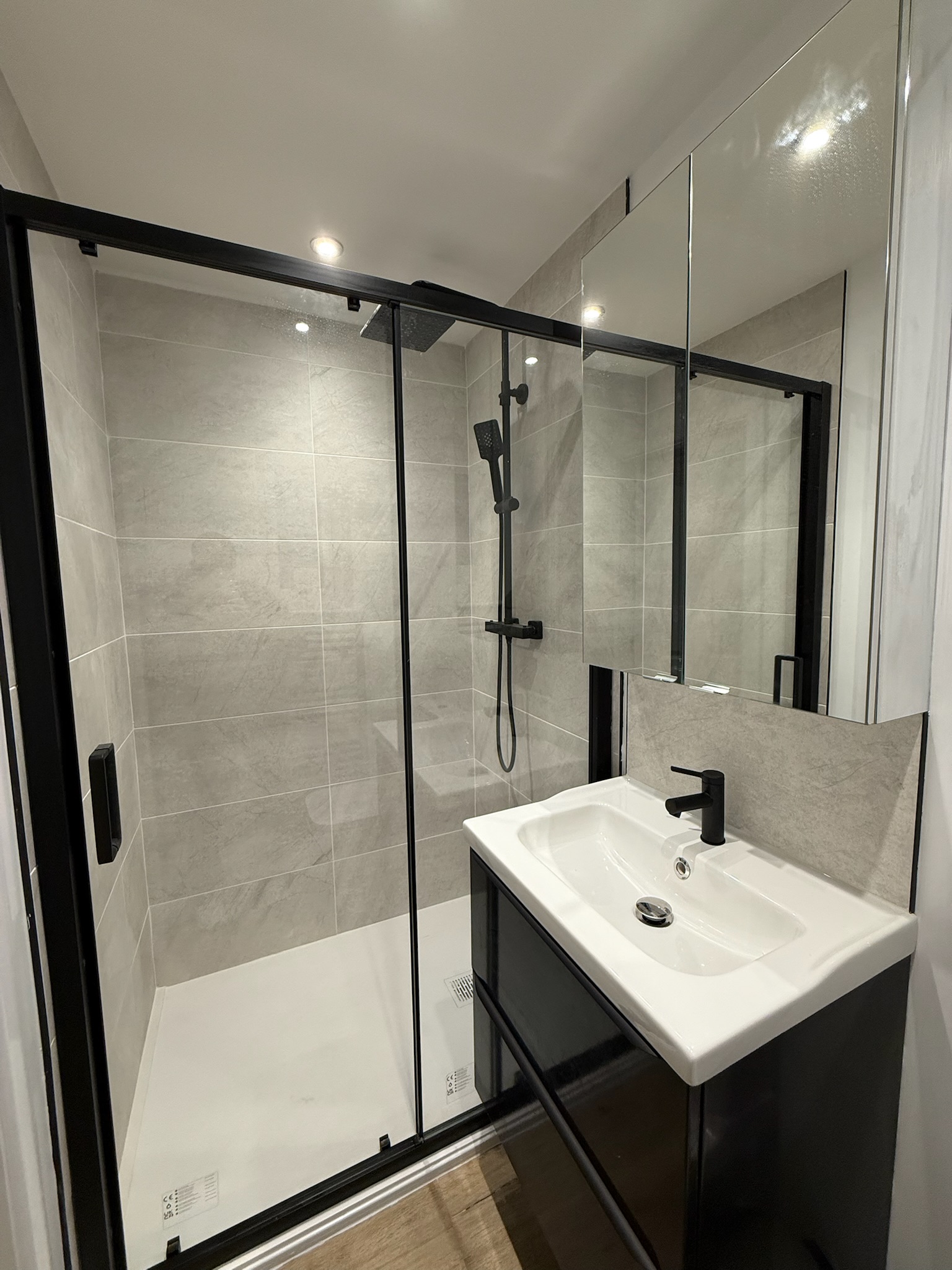 Modern en suite shower room installed within a double garage conversion in Leigh