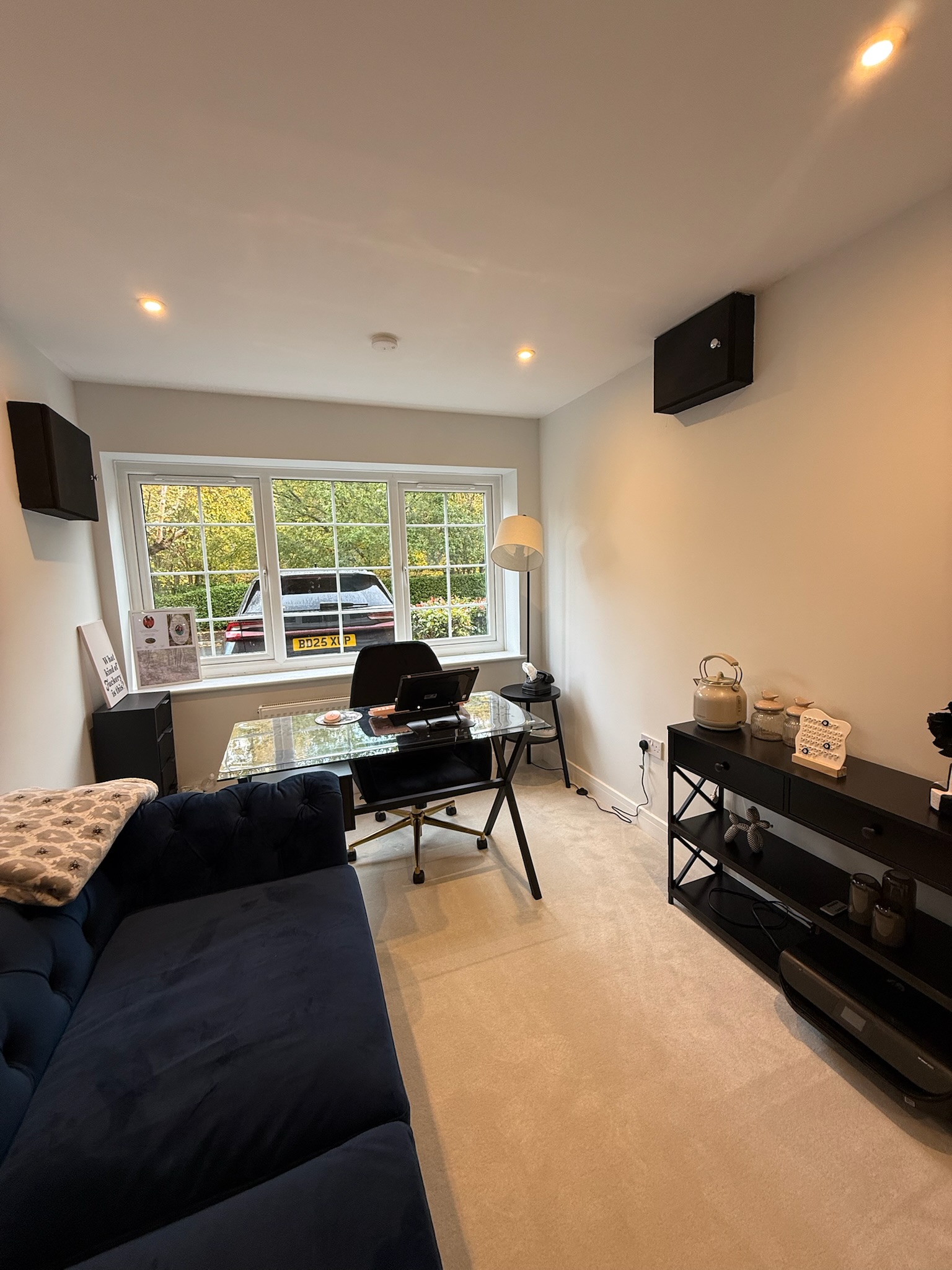 Attached single garage conversion transformed into a home office and utility room with fitted workspace and natural light
