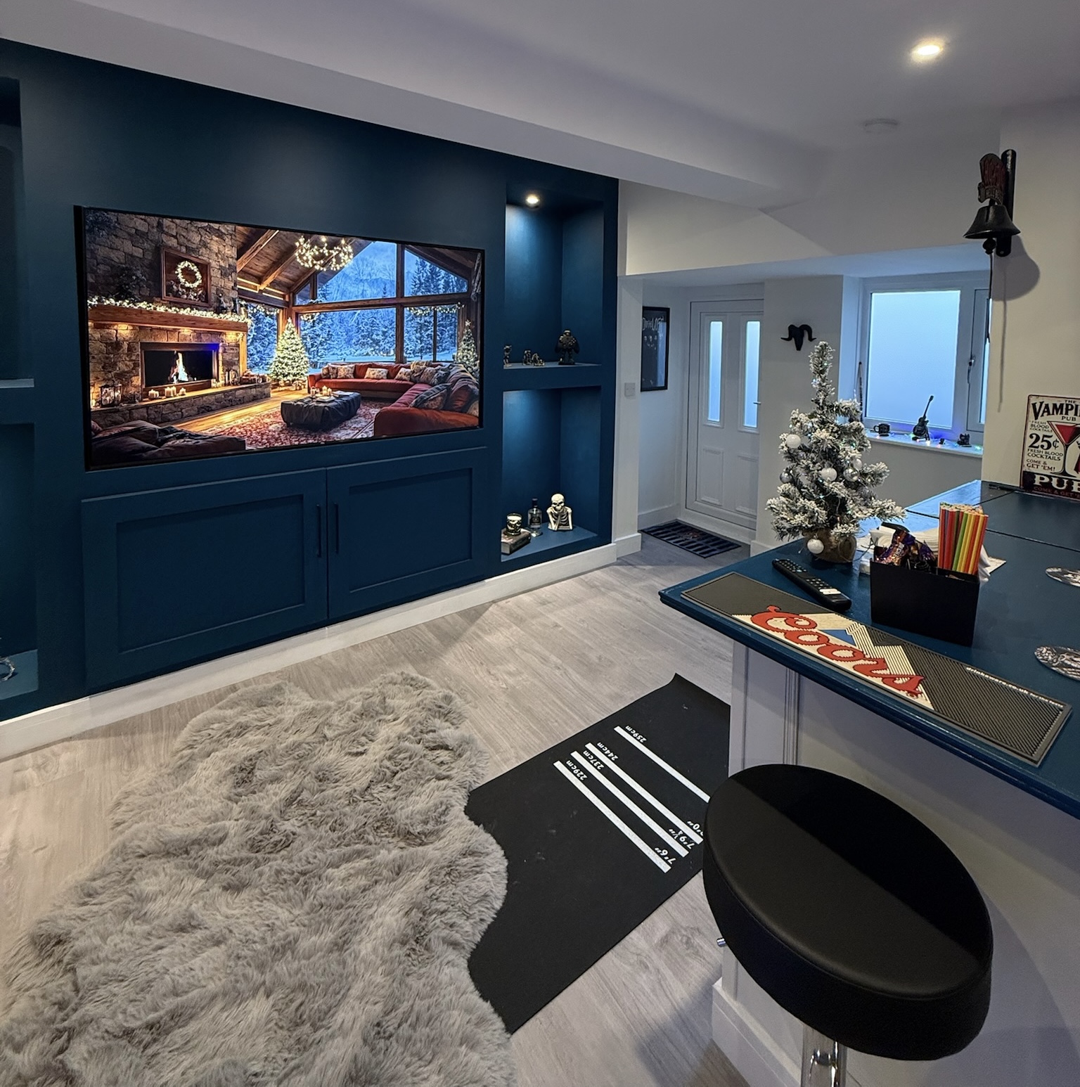 Detached garage converted into a modern man cave with a built in bar, bespoke media wall and fitted storage in Wallasey. Detached garage converted into a modern man cave with a built in bar, bespoke media wall and fitted storage in Wallasey.