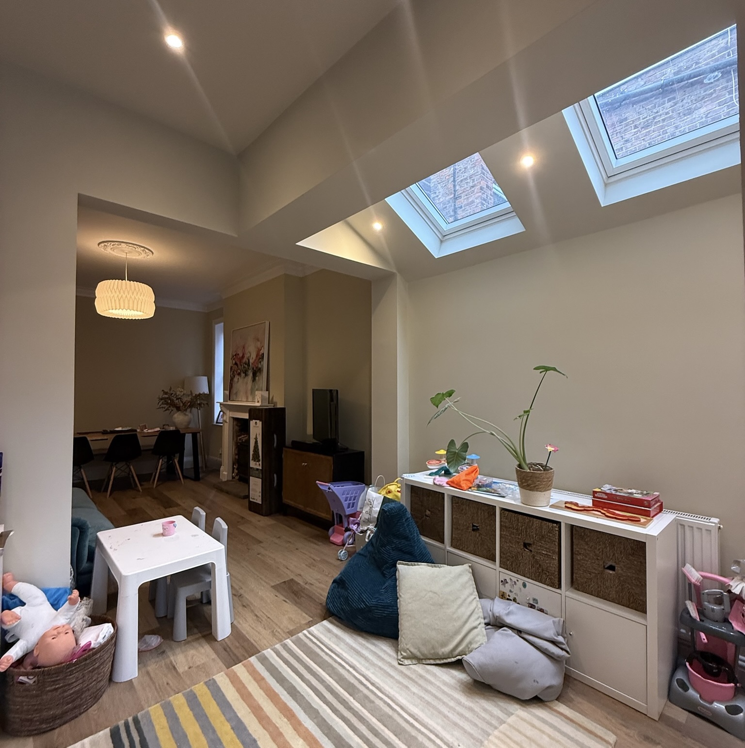 Side extension in Eccles featuring open plan kitchen and family room with skylights, additional living space, natural light and modern home extension design.