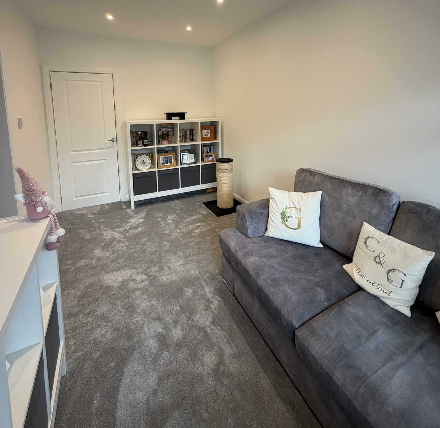 Single garage conversion in Oldham creating a family room while keeping rear garage storage for household items and equipment.