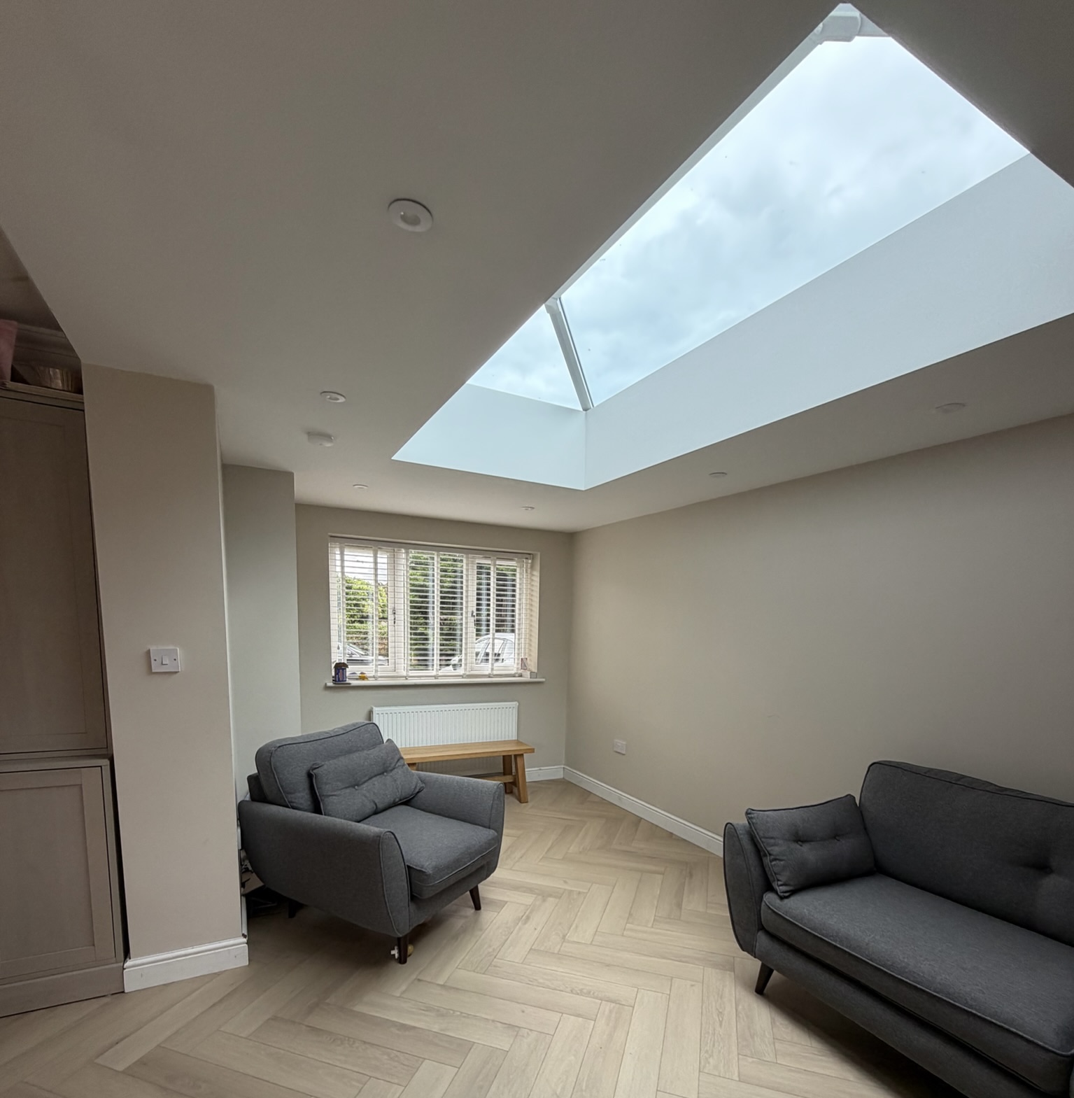 Single garage converted into an open plan living room with a roof lantern for natural light in Leeds.