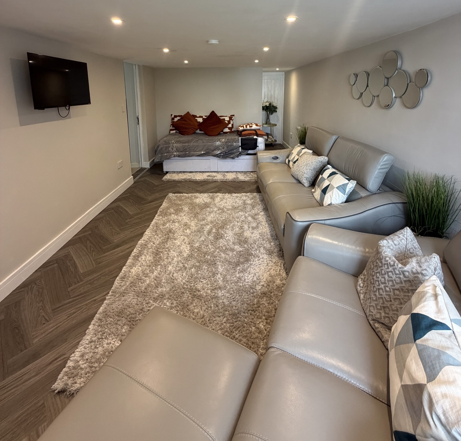Garage conversion into a granny annexe in Liverpool with bedroom, living area and en suite, creating comfortable accommodation for an ageing parent close to home.