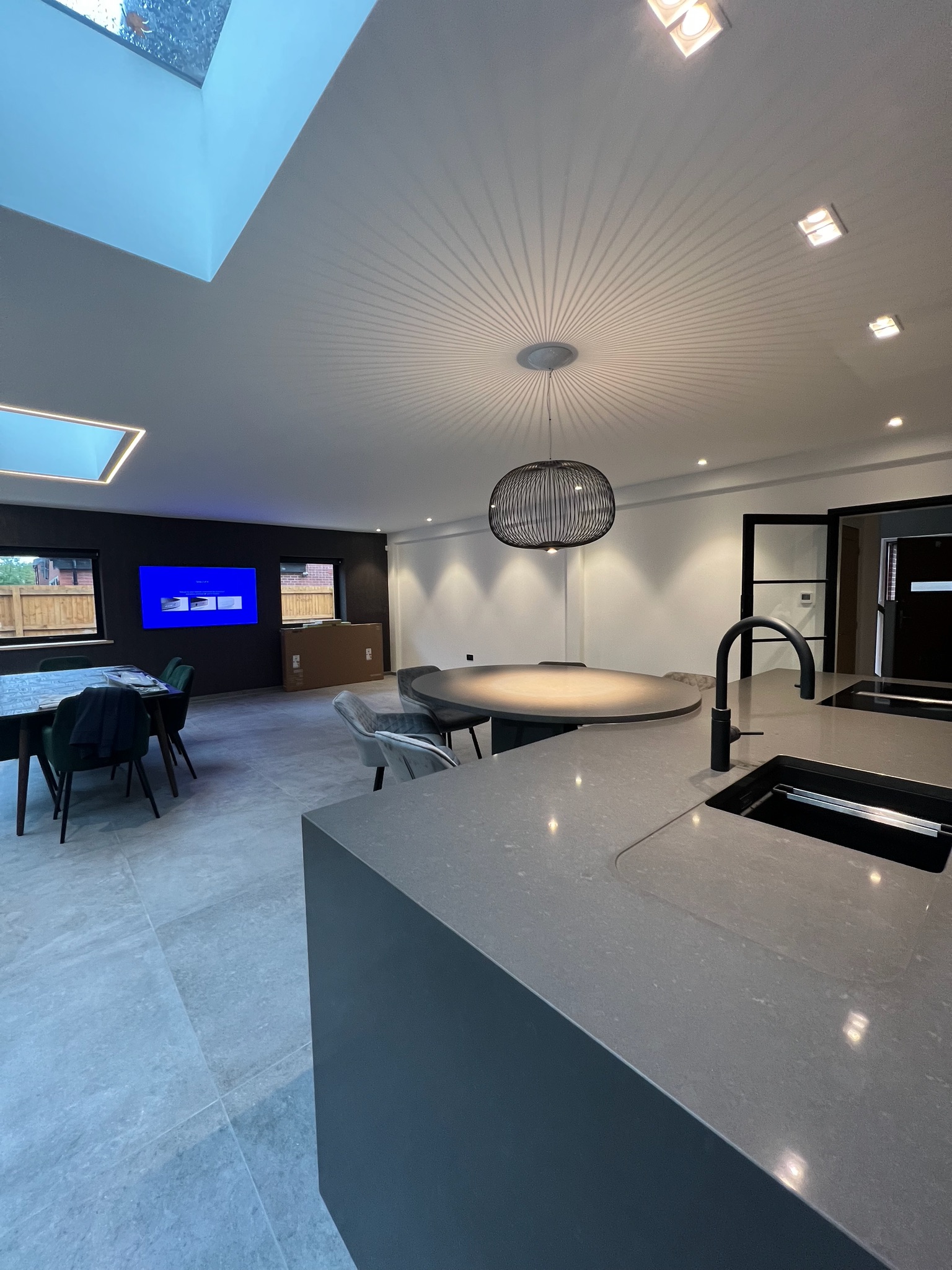 Modern kitchen extension in Prestwich creating a spacious open plan kitchen, dining and living area with rooflights, increased natural light and a layout designed for modern family living.