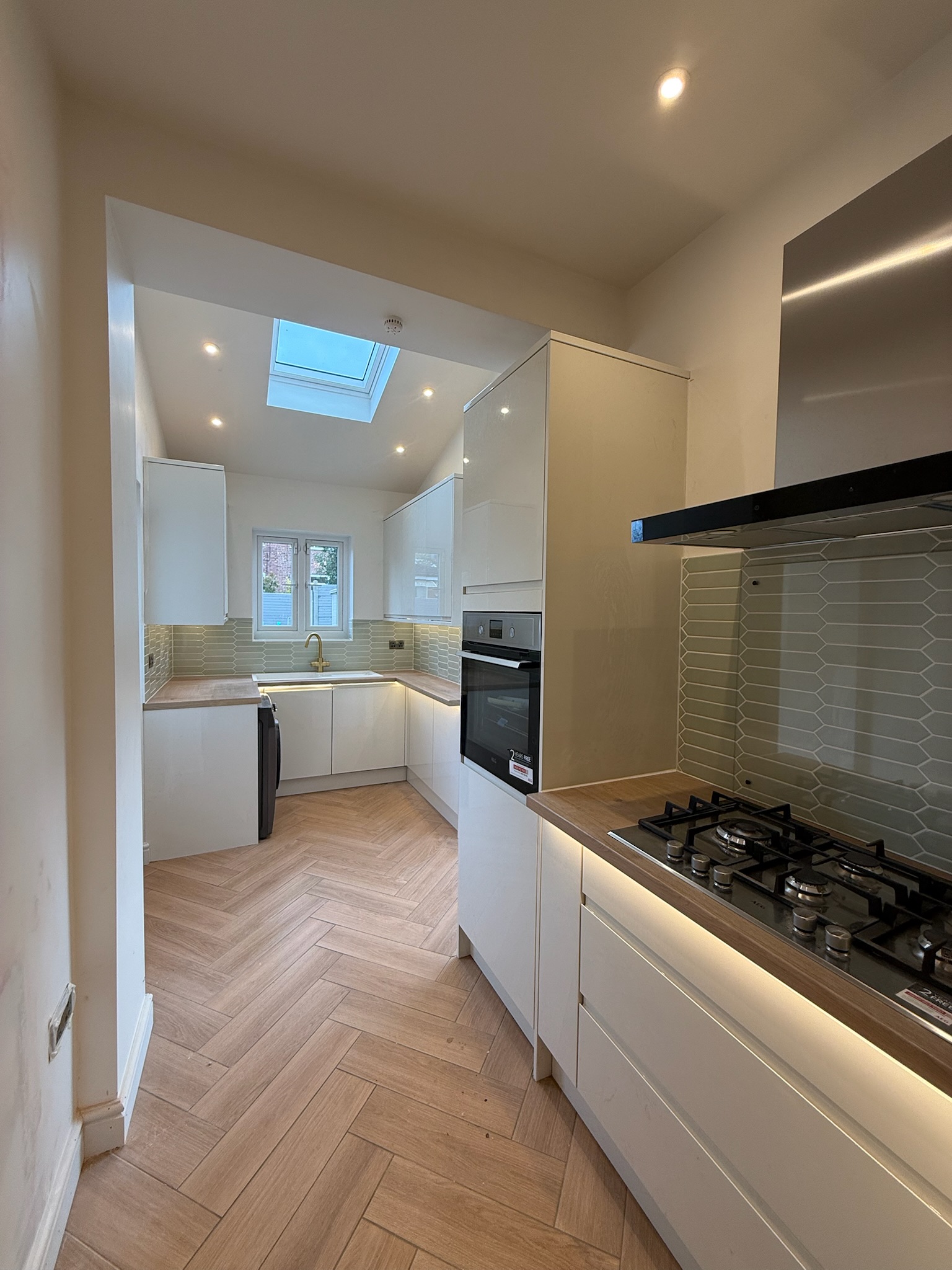 Modern rear kitchen extension in Eccles creating a larger, brighter kitchen with a rooflight, improved layout and more practical space for everyday family living.