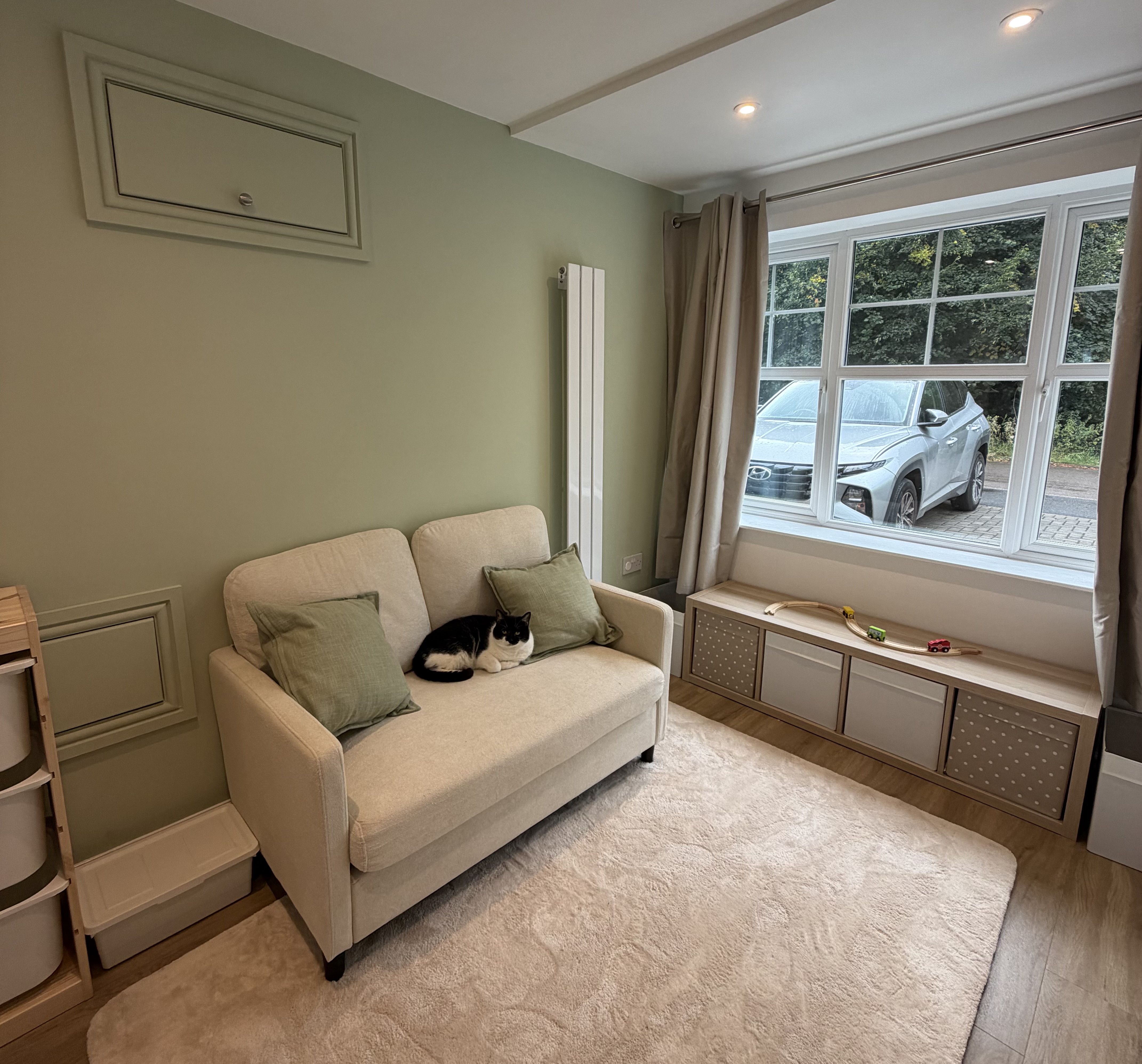 Finished attached single garage conversion in Lower Darwen transformed into a living space with an adjoining utility area. Finished attached single garage conversion in Lower Darwen transformed into a living space with an adjoining utility area.