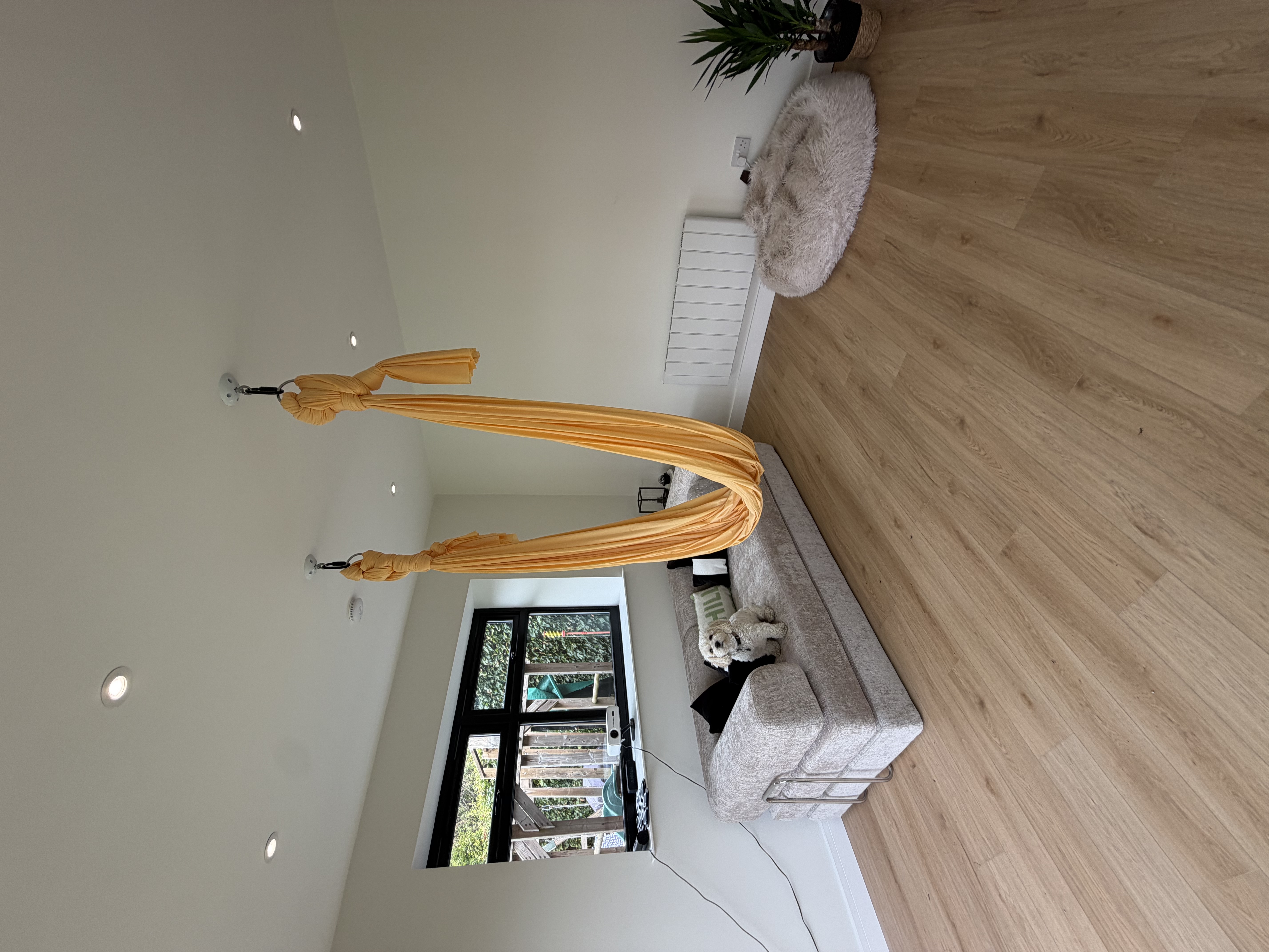 Detached garage conversion into a snug and gymnastics room in Wilmslow with aerial silks and new window Detached garage conversion into a snug and gymnastics room in Wilmslow with aerial silks and new window