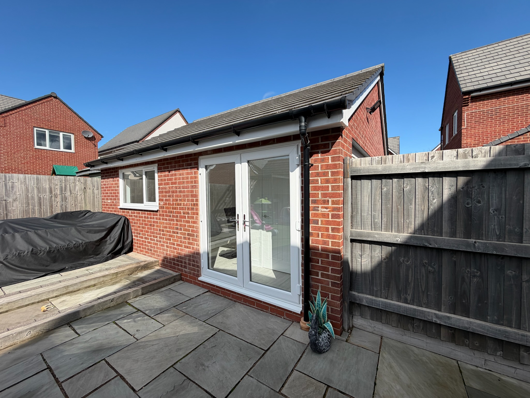Single garage conversion in Wigan transformed into a home office with retained front storage and additional roof storage accessed by a loft hatch. Single garage conversion in Wigan transformed into a home office with retained front storage and additional roof storage accessed by a loft hatch.