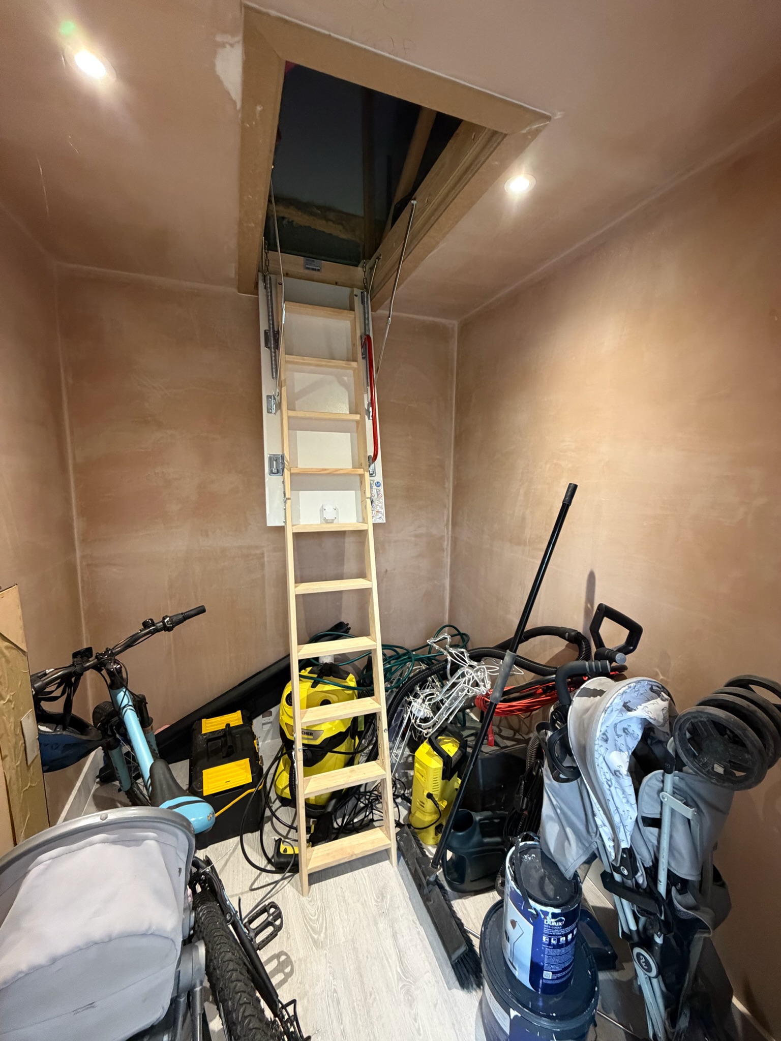 Garage conversion in Wigan with a dedicated storage area and loft hatch providing access to additional storage space within the garage roof. Garage conversion in Wigan with a dedicated storage area and loft hatch providing access to additional storage space within the garage roof.