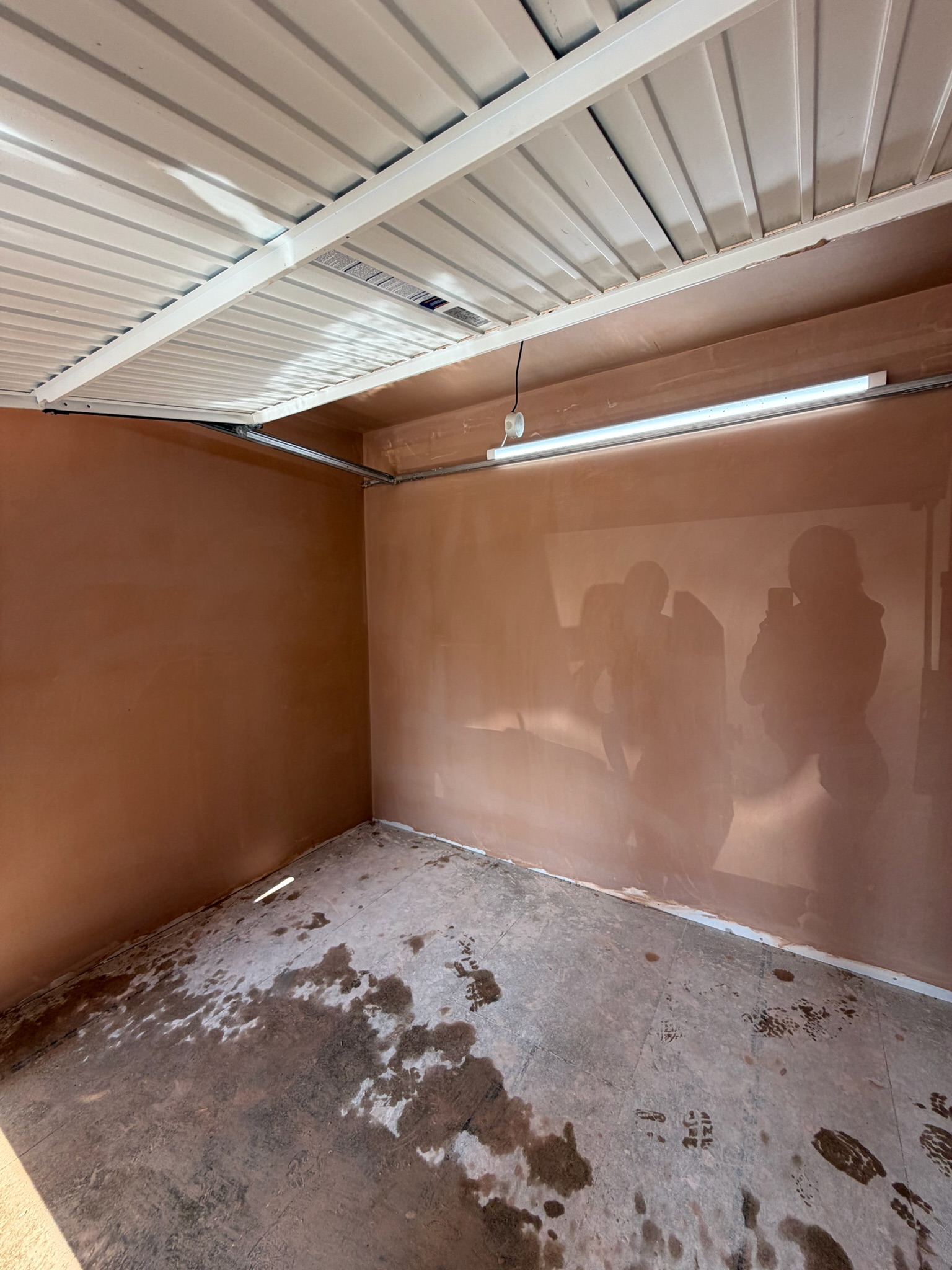 Garage conversion in Atherton with the original garage door retained to provide a separate storage area at the front of the converted space. Garage conversion in Atherton with the original garage door retained to provide a separate storage area at the front of the converted space.