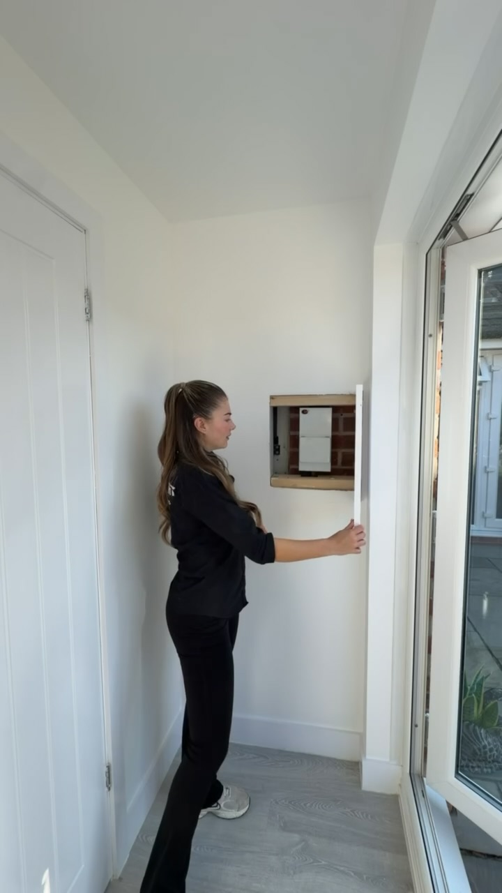 Single garage conversion in Stockport transformed into a home office, featuring a recessed wall access cupboard for existing electrical equipment. Single garage conversion in Stockport transformed into a home office, featuring a recessed wall access cupboard for existing electrical equipment.