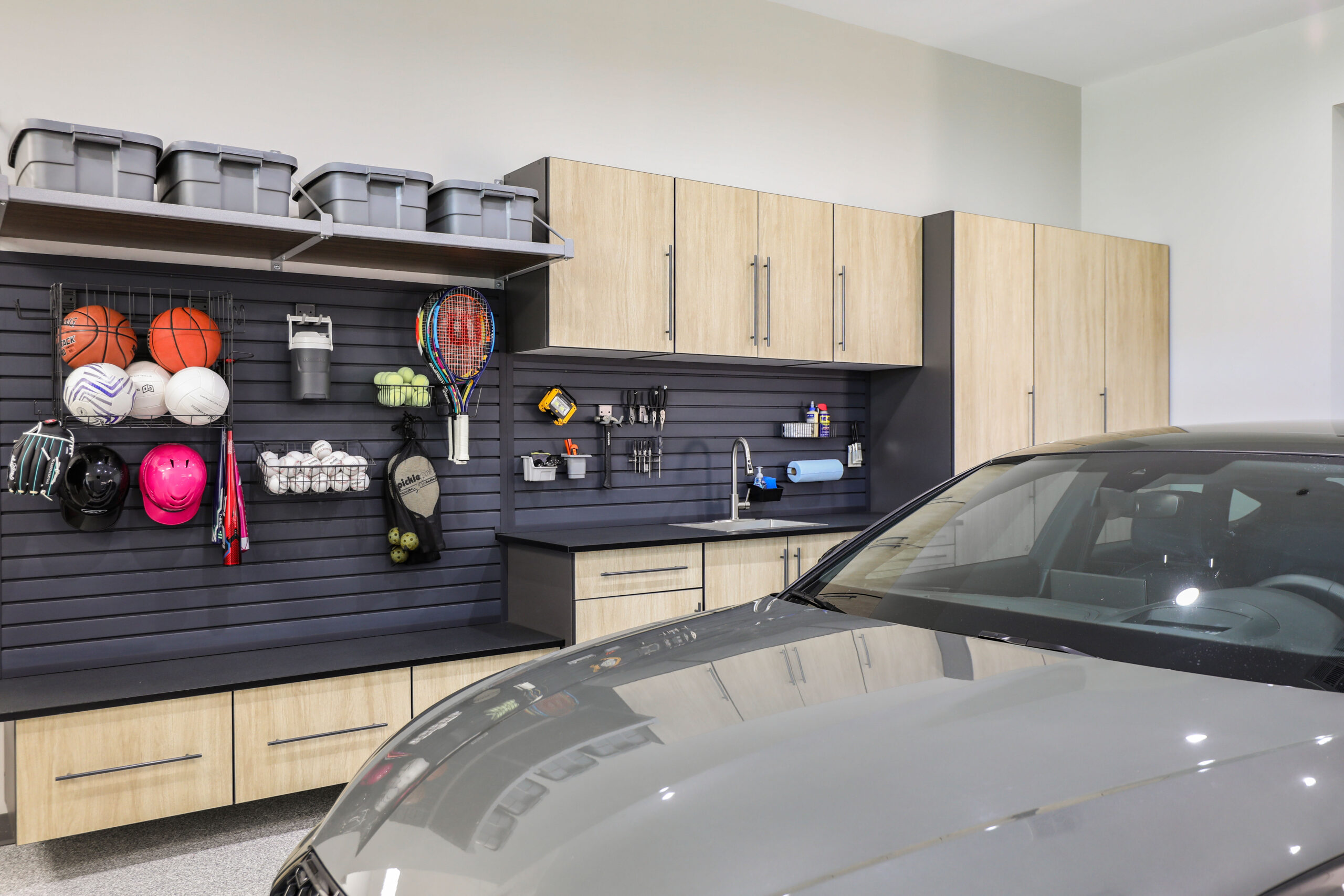 Finished garage with custom cabinets and organization