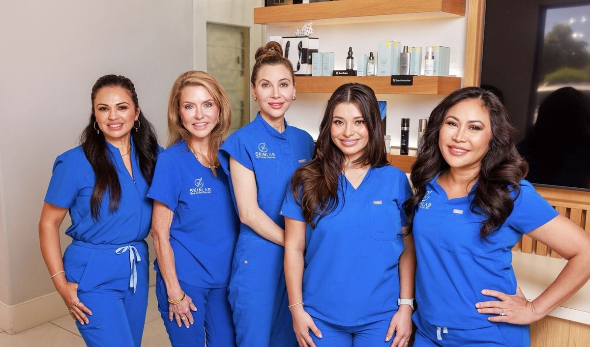 The SkinLab team in their blue scrubs at the Chandler med spa