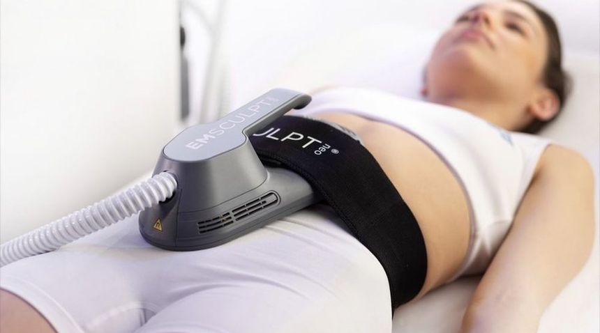 EmSculpt NEO applicator on the abdomen