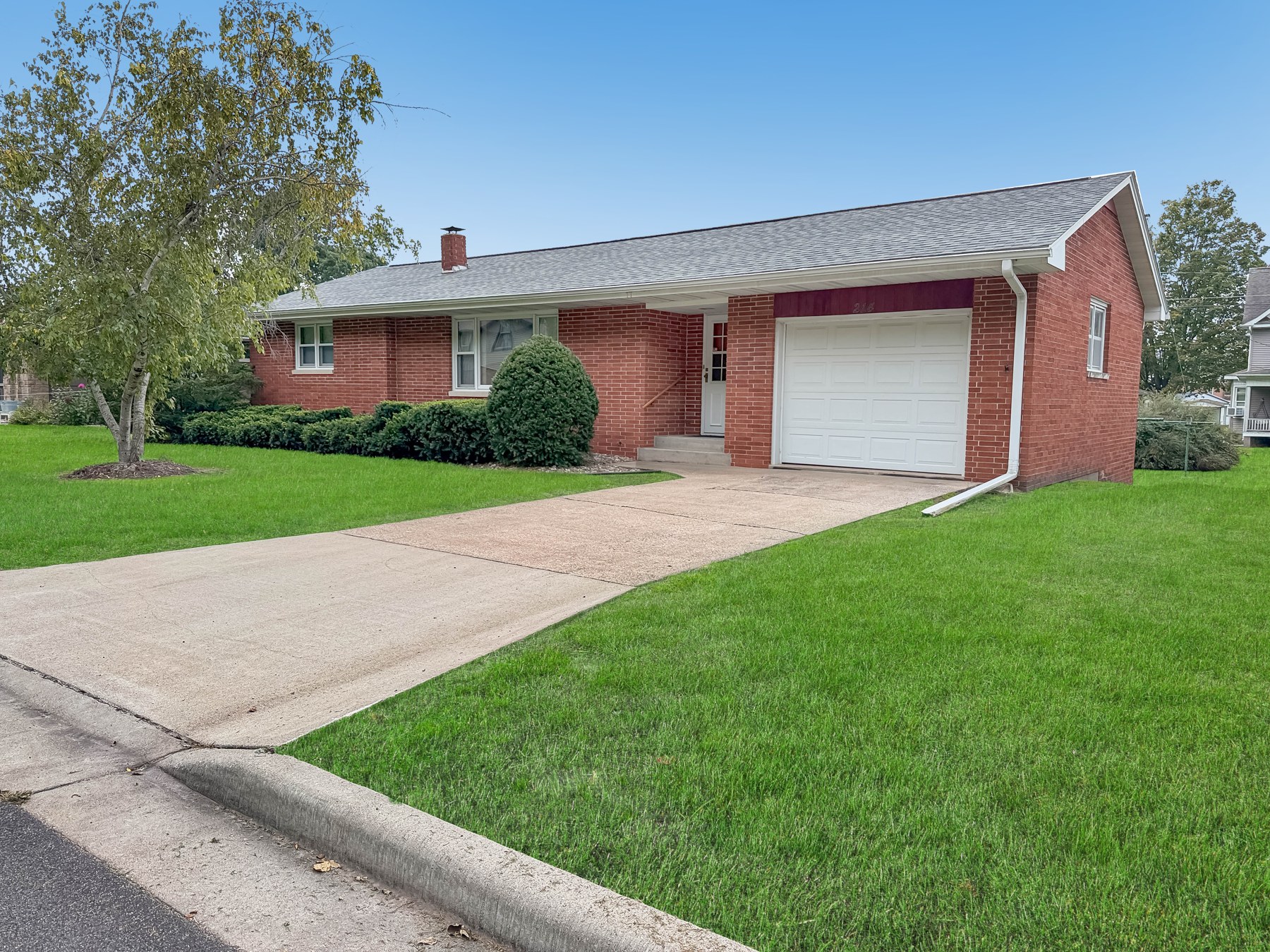 Brick home and attached garage at 214 E Bluff Street in Cassville