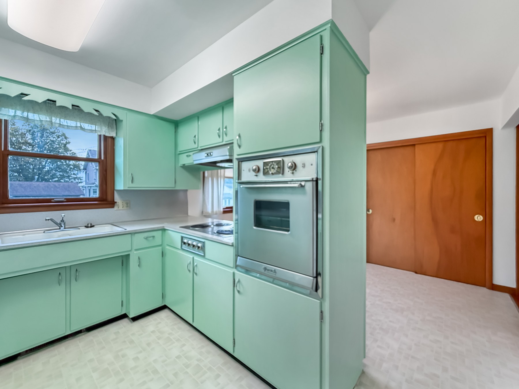 Actual kitchen with green cabinetry