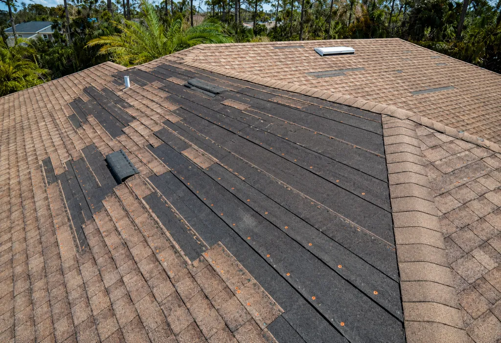 Residential roof inspected after storm damage in Kansas City
