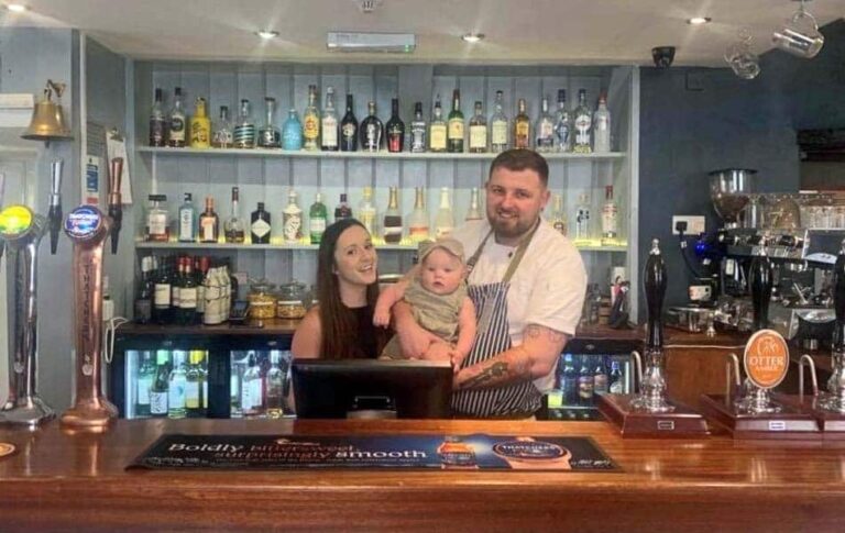 Chagford Inn proprietors Jordan and Ollie with their daughter behind the bar