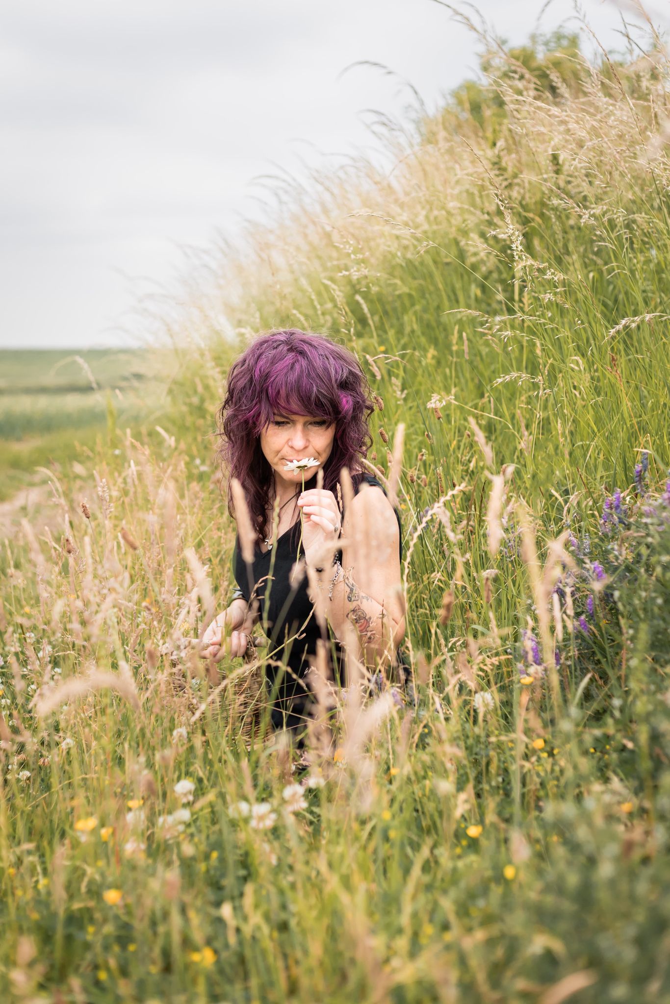 Kylie Dixon standing in a field of heather