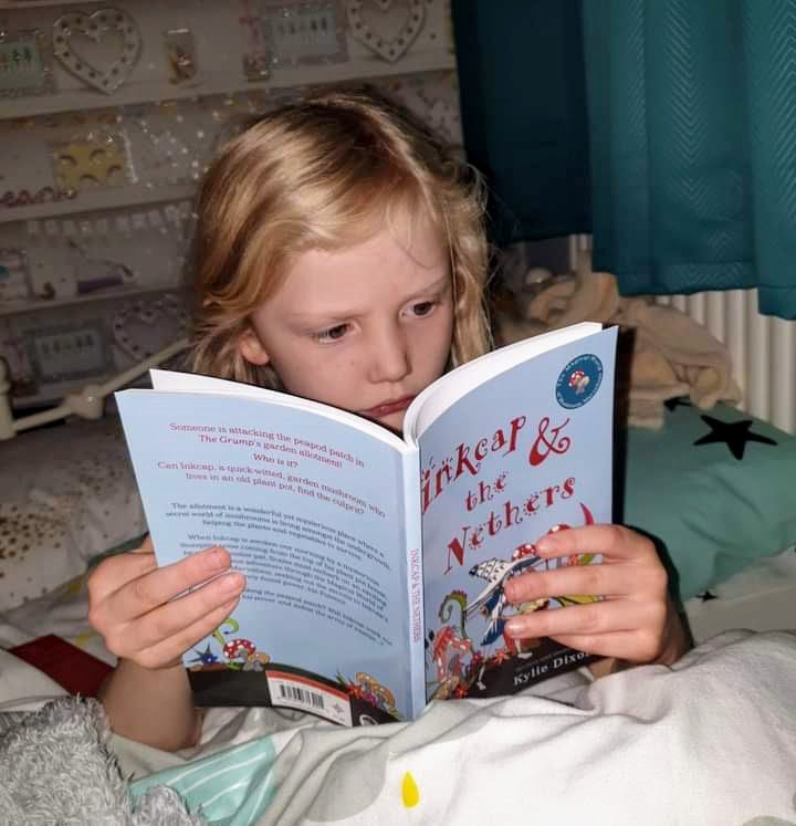 A child reading Inkcap & The Nethers