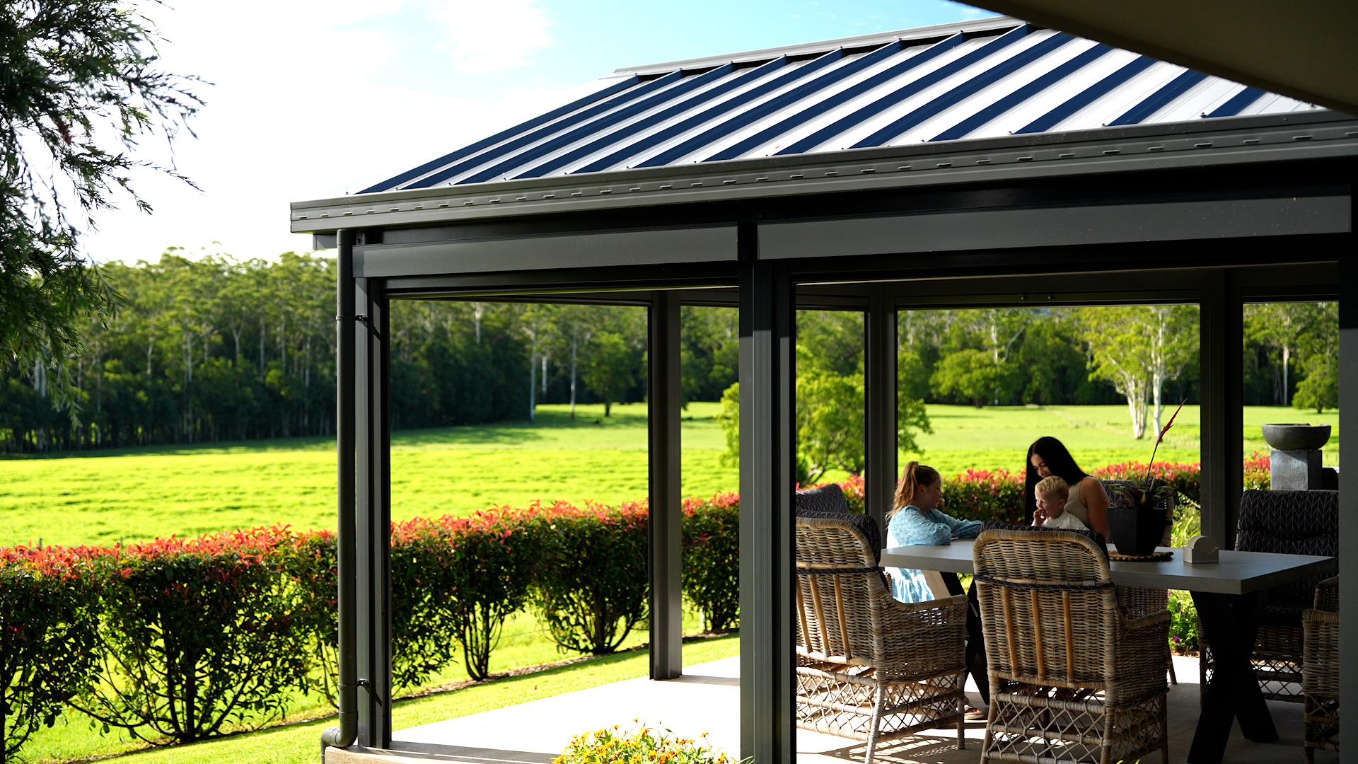 Insulated glass-room patio overlooking green pasture, Coffs region