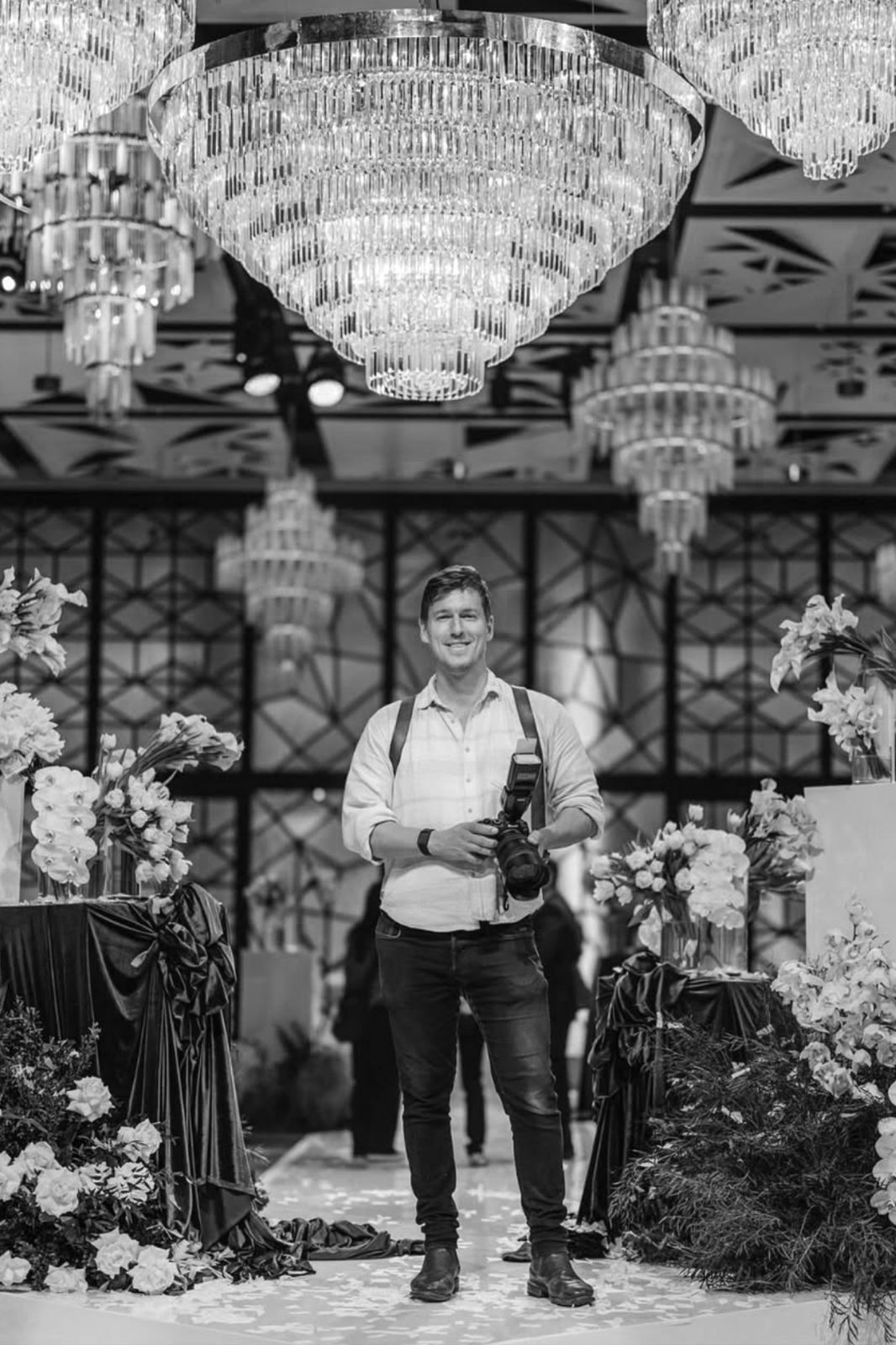 Jesse of Collections Photography photographing in a ballroom