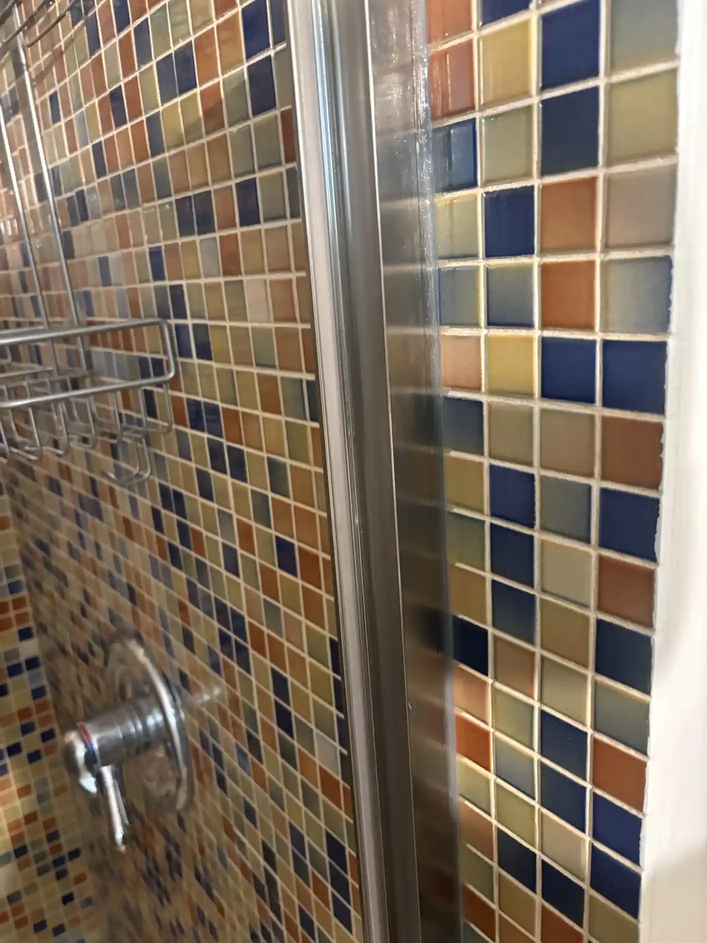 After shot — natural stone tile surface cleared of mineral haze, grout lines restored to actual color