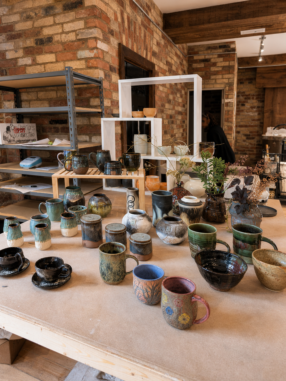 Two students smiling inside Spin Pottery Studio