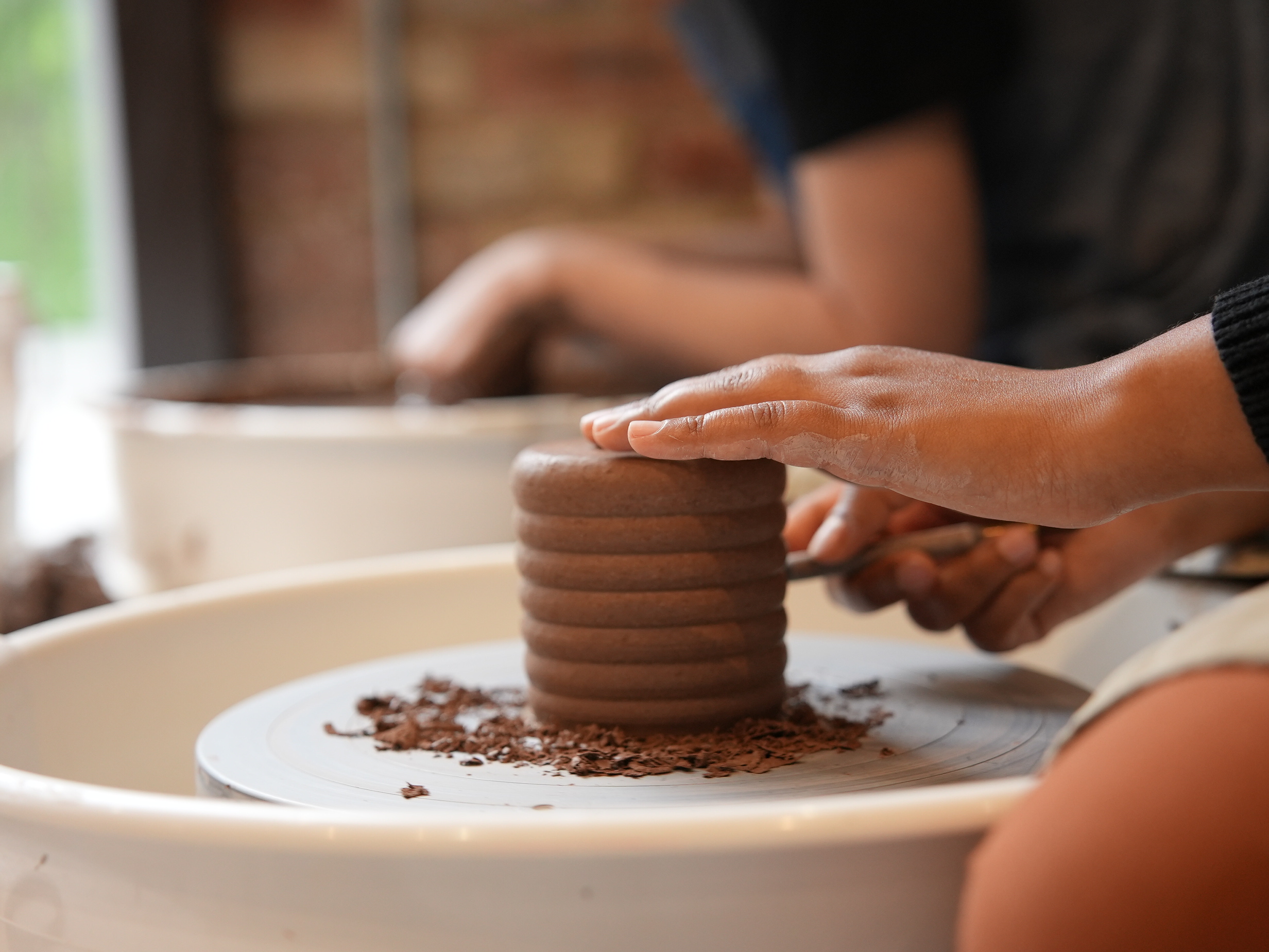 Student painting pottery