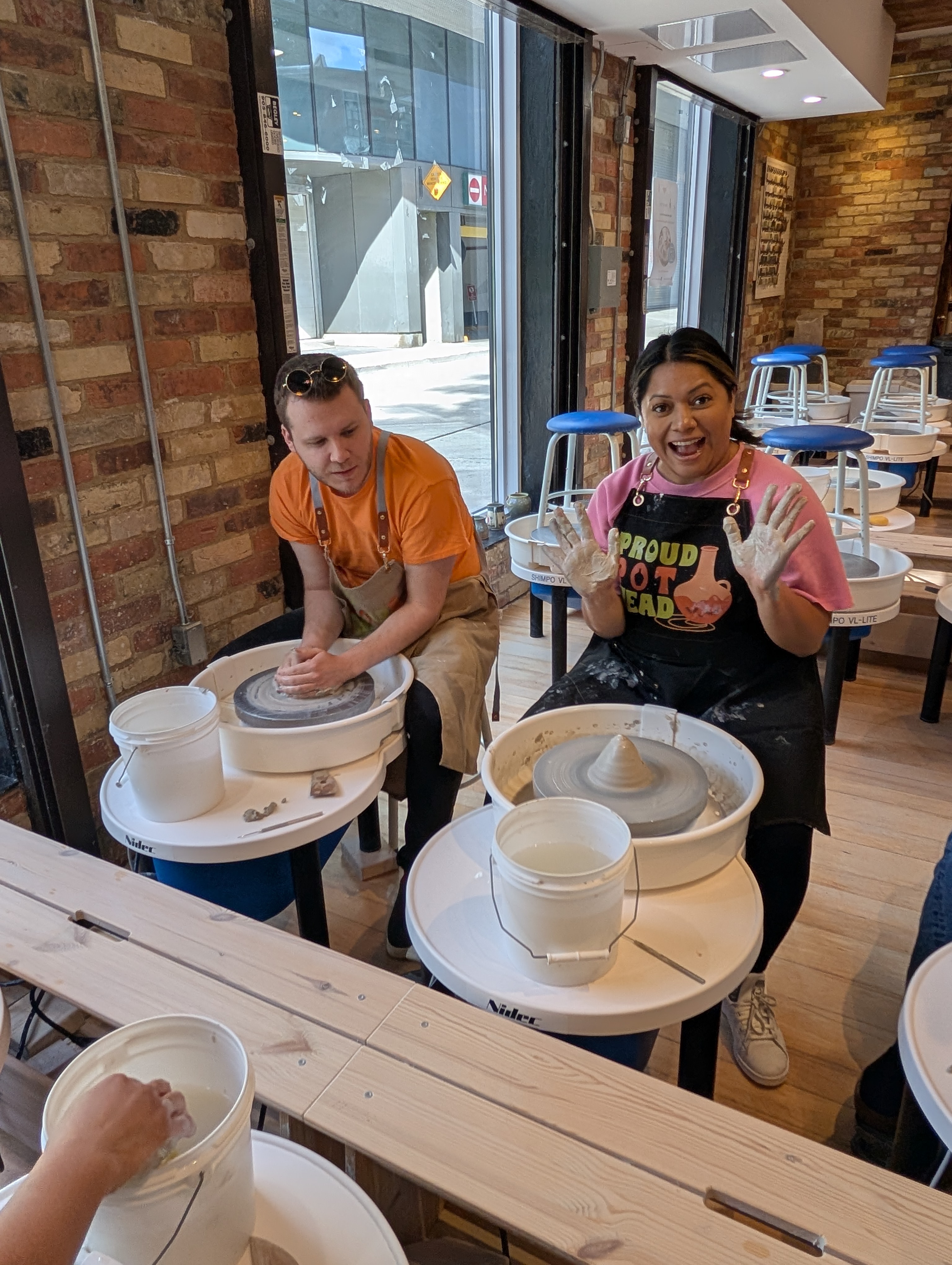 Group enjoying a private pottery experience at Spin Pottery Studio