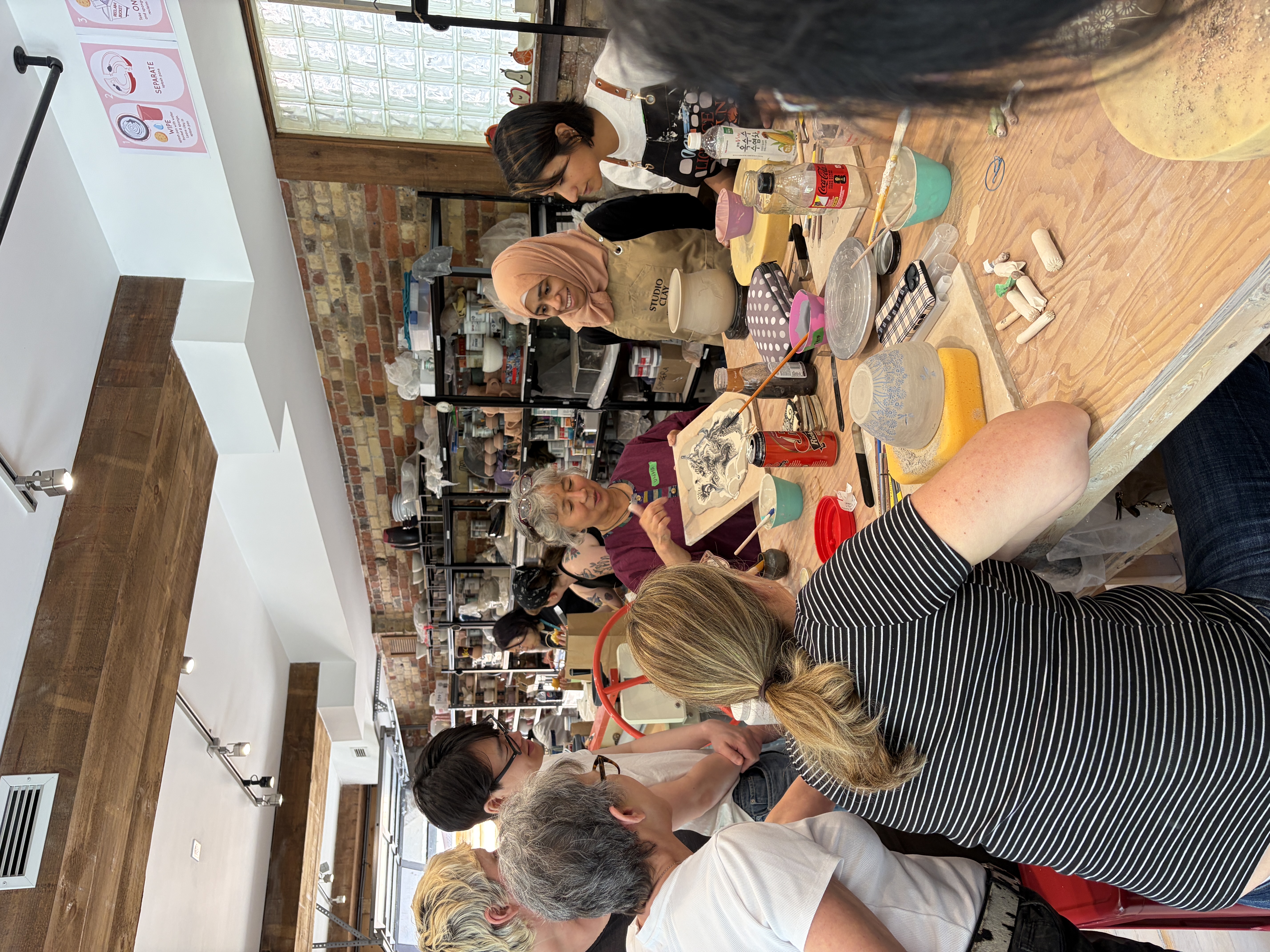 Private group enjoying a pottery workshop at Spin Pottery Studio