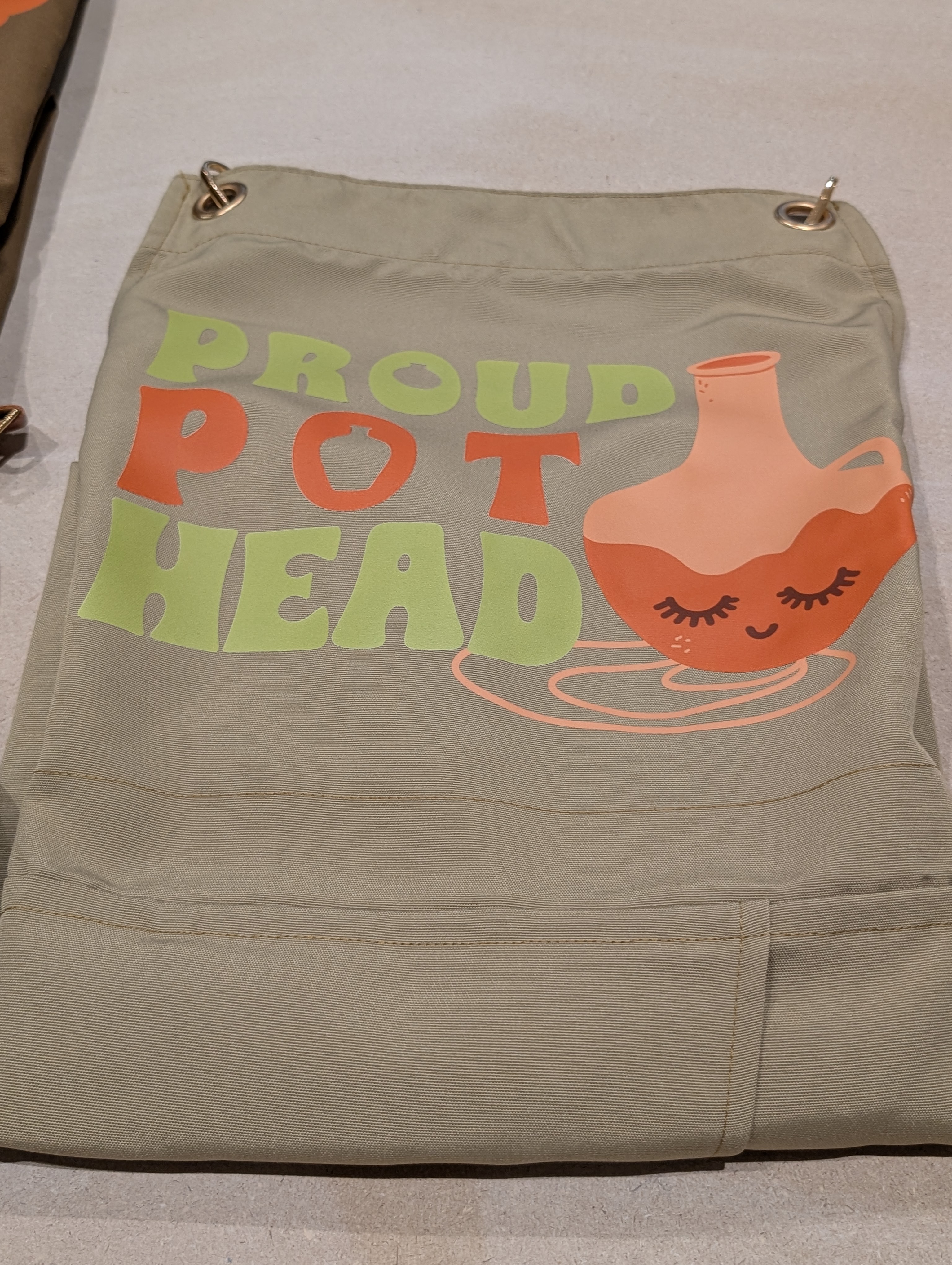 Proud Pothead — Green & Orange split-leg pottery apron