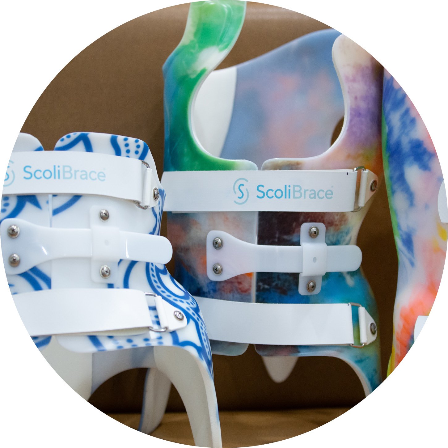 Colorful children's orthopedic ScoliBrace braces in various sizes and colors