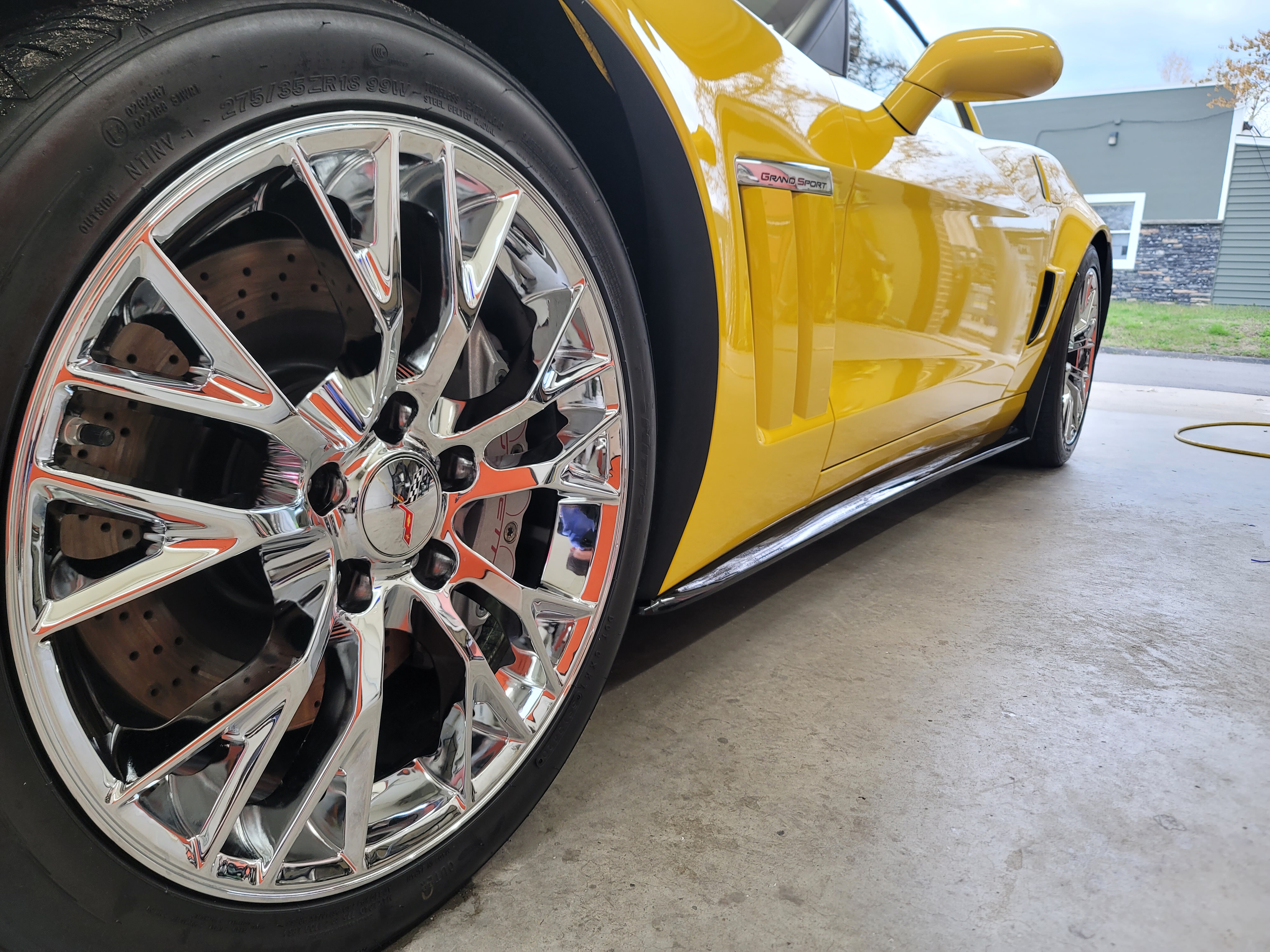 Extreme close-up of glossy protected vehicle paint with gold reflections
