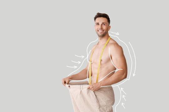 A patient measuring their waist during a body composition check