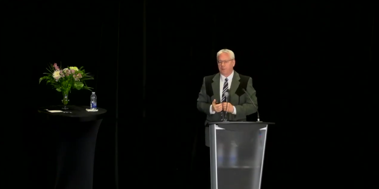 Image of John giving a keynote speech