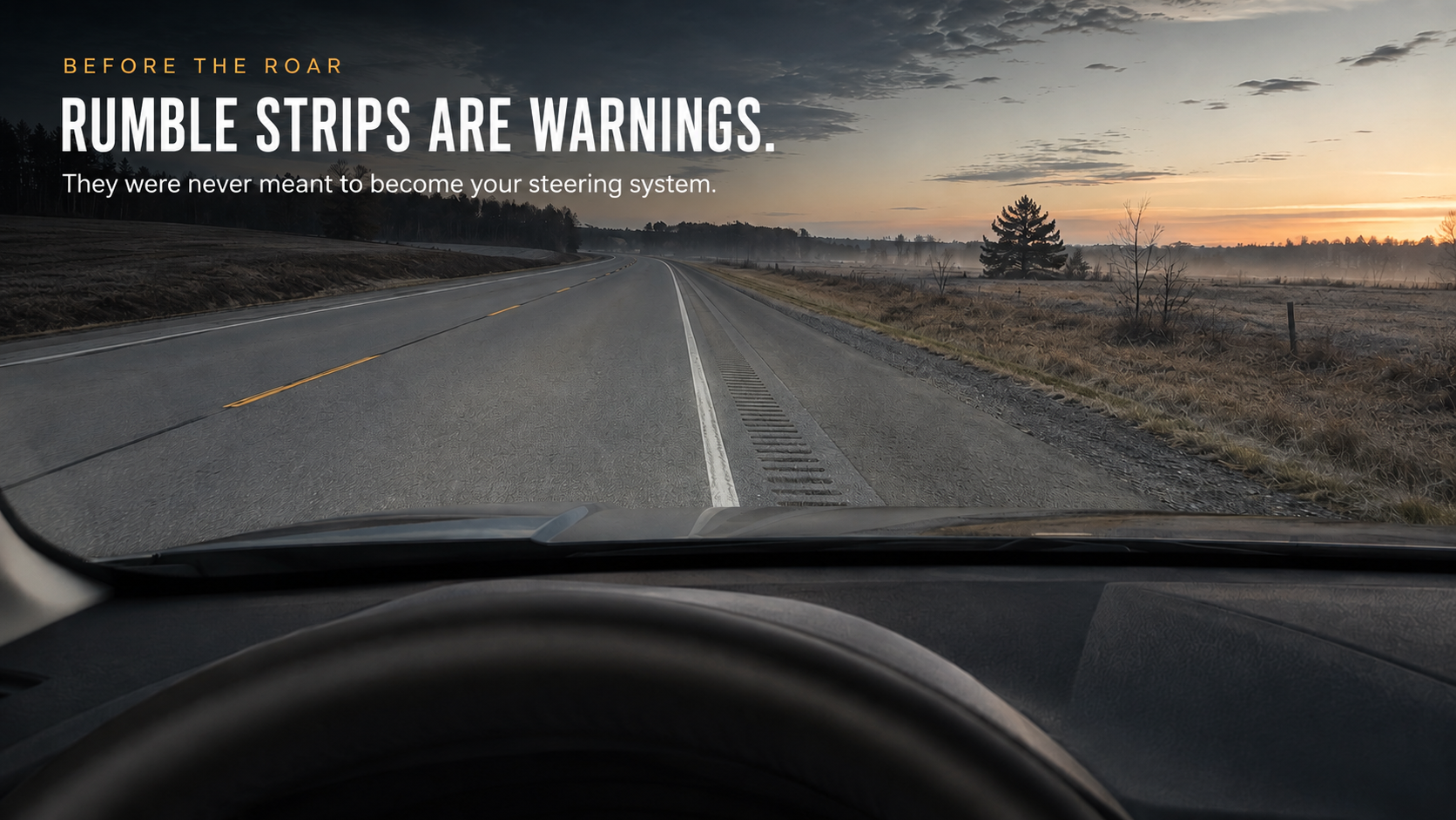 View from the windshield of a vehicle driving towards the rumble strips with the words, 