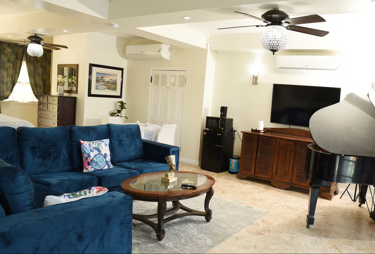 Spacious Living & Lounge Area with Sectional Sofa Bed & Piano