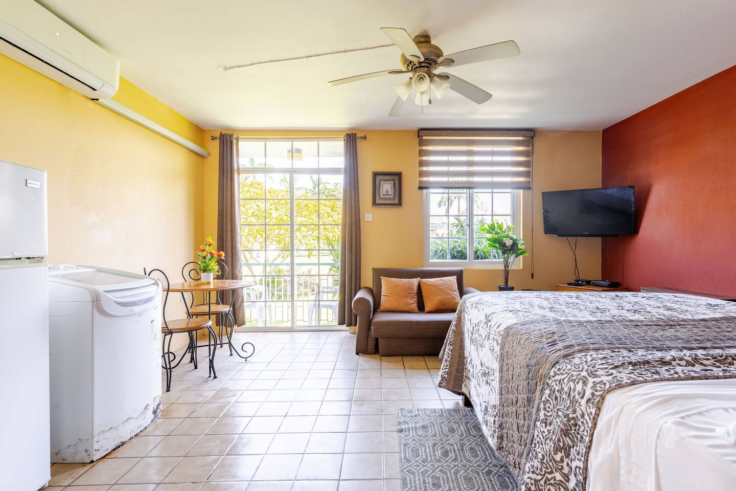 Sunlit Studio Interior with Comfortable Seating & Tile Floors