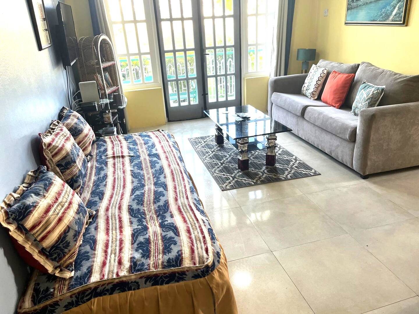 Spacious Living Salon with Tiled Floor & Garden Patio View