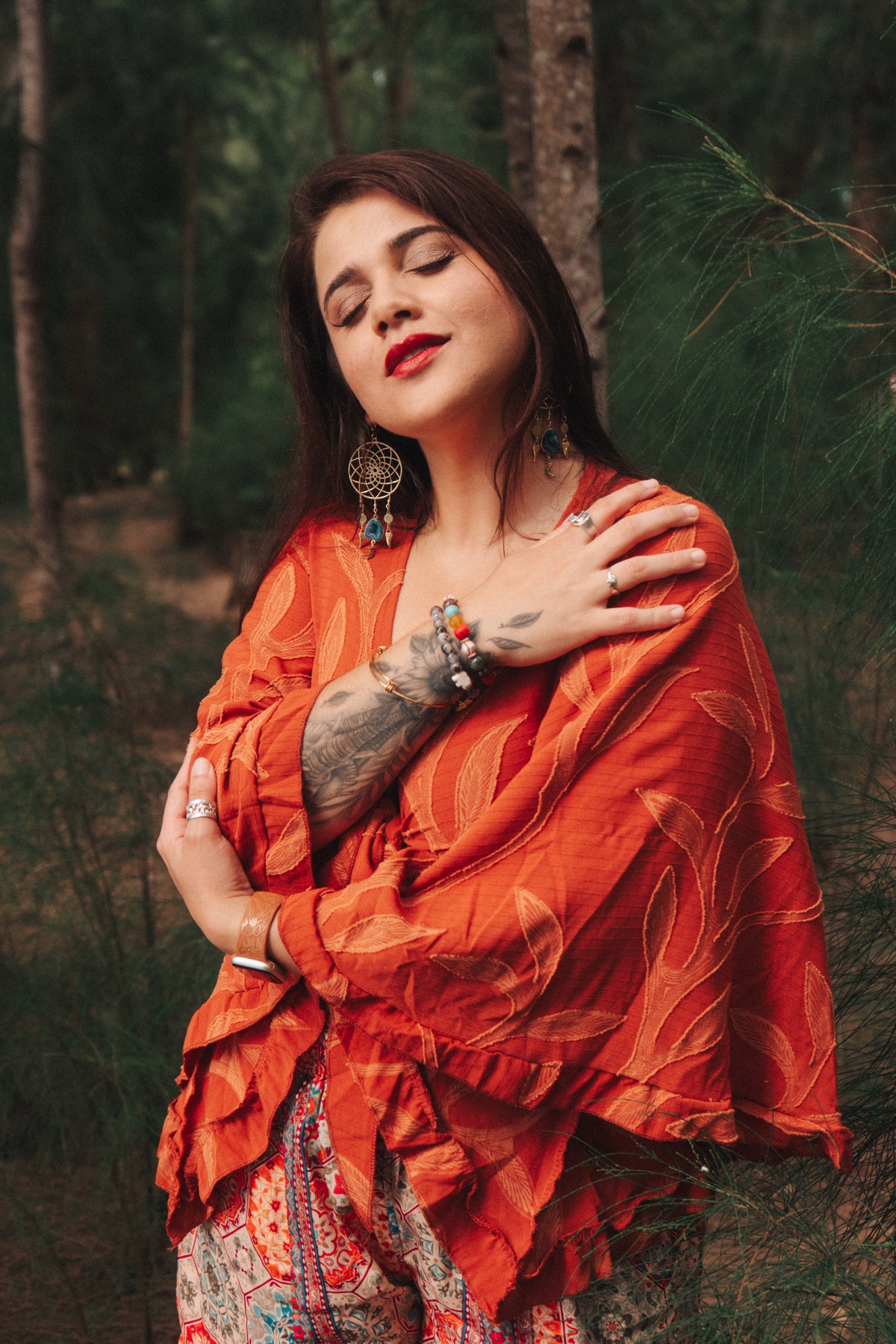 Laura C. Genao standing peacefully in a wooded setting
